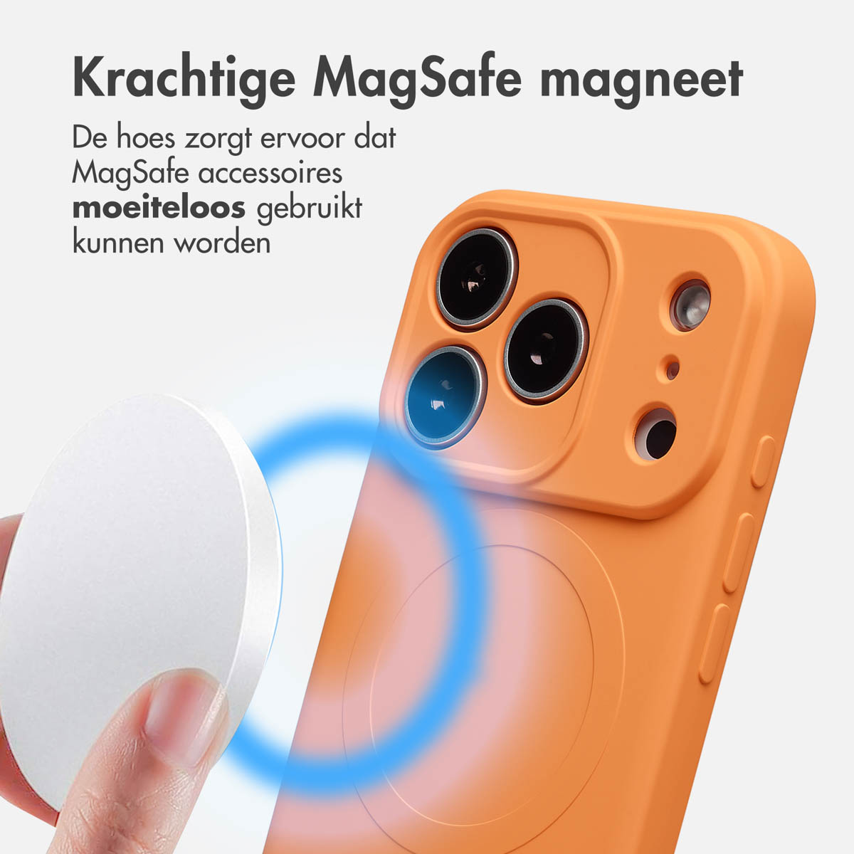 Een oranje telefoonhoesje met een witte magneetschijf ernaast. Nederlandse tekst: 'Krachtige MagSafe-magneet'.