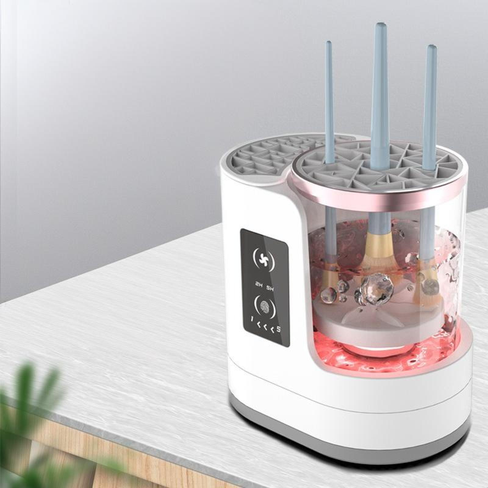 Ein weißer und grauer Make-up-Pinselreiniger. Pinsel befinden sich in einem durchsichtigen Behälter mit Wasser. Rotes Licht unten.