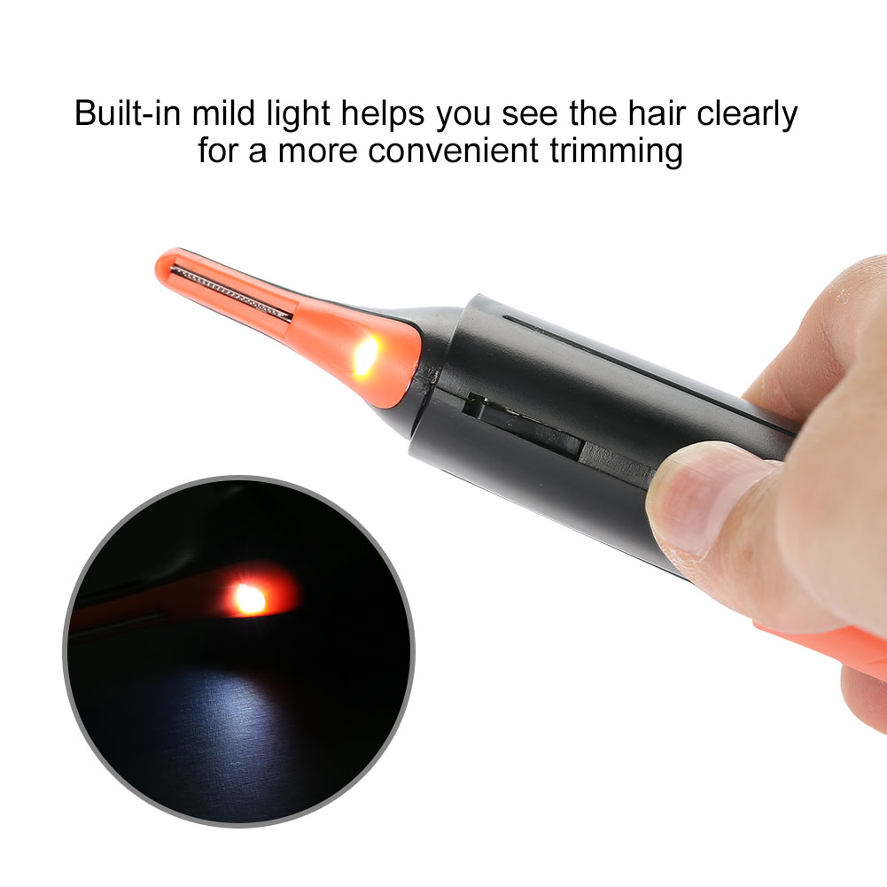 Ein orange-schwarzer Haarschneider mit eingebautem Licht wird von einer Hand gehalten. Eine vergrößerte Ansicht zeigt die Lichtquelle.