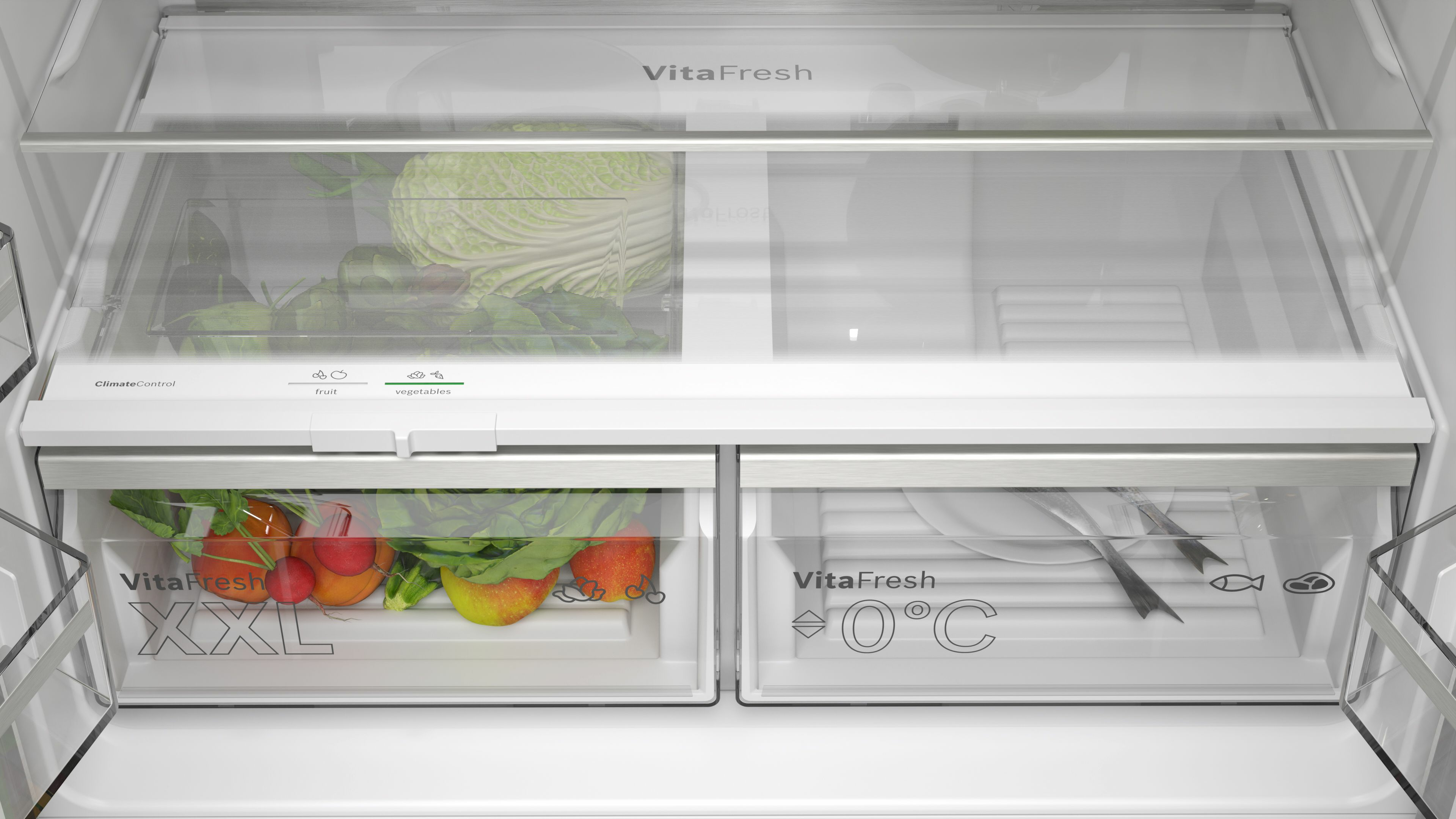 In een koelkast worden groenten en fruit bewaard in doorzichtige lades. Het bovenste compartiment bevat een kool.