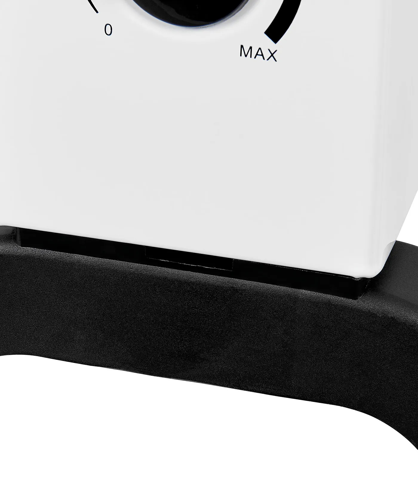 Nahaufnahme eines weißen Geräts mit einem schwarzen Zifferblatt, das 'MAX' anzeigt. Eine schwarze Basis stützt das Gerät.