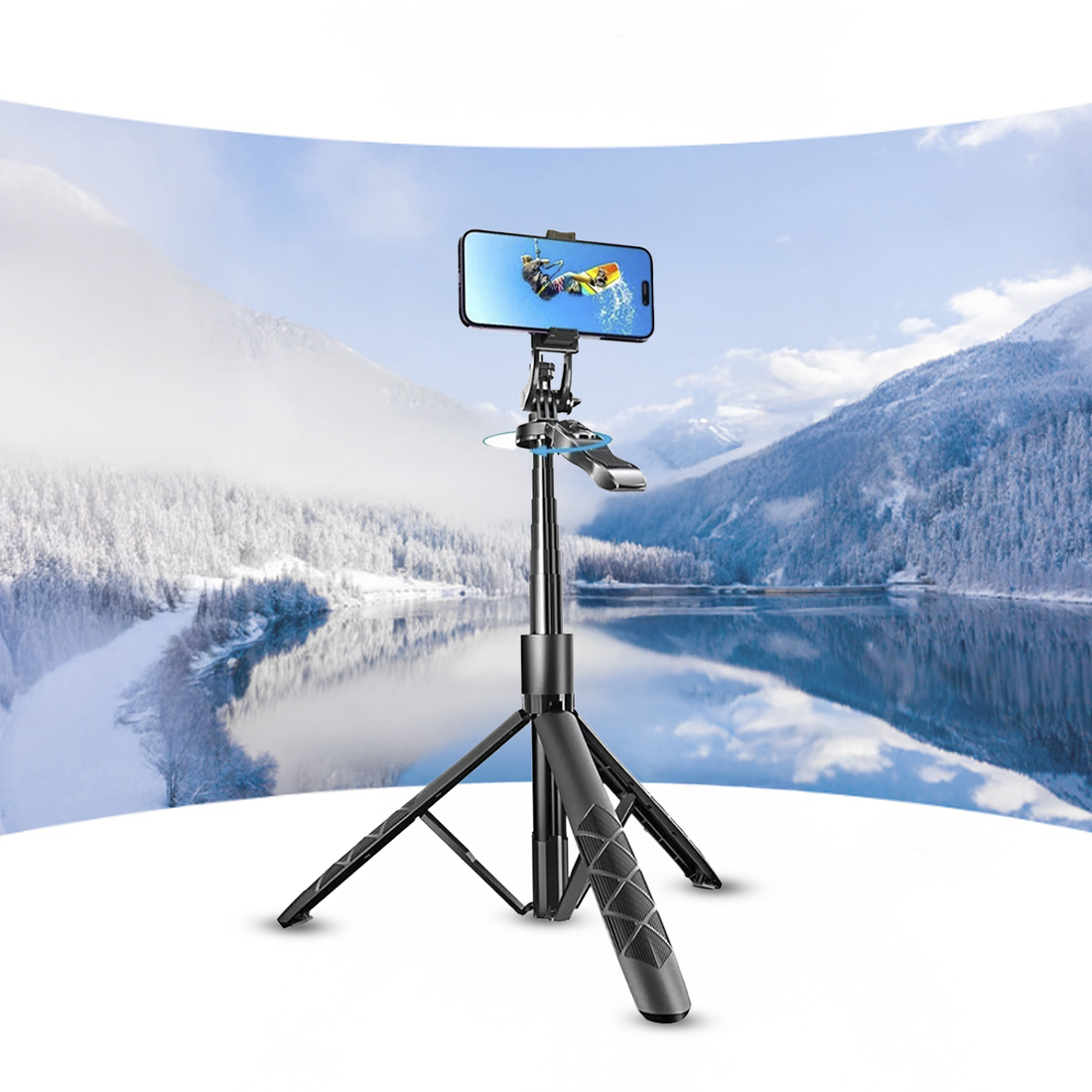 Bir tripod üzerindeki telefon, sörf yapan bir kişiyi gösteriyor. Arka planda karlı bir dağ silsilesi ve sakin bir göl var.
