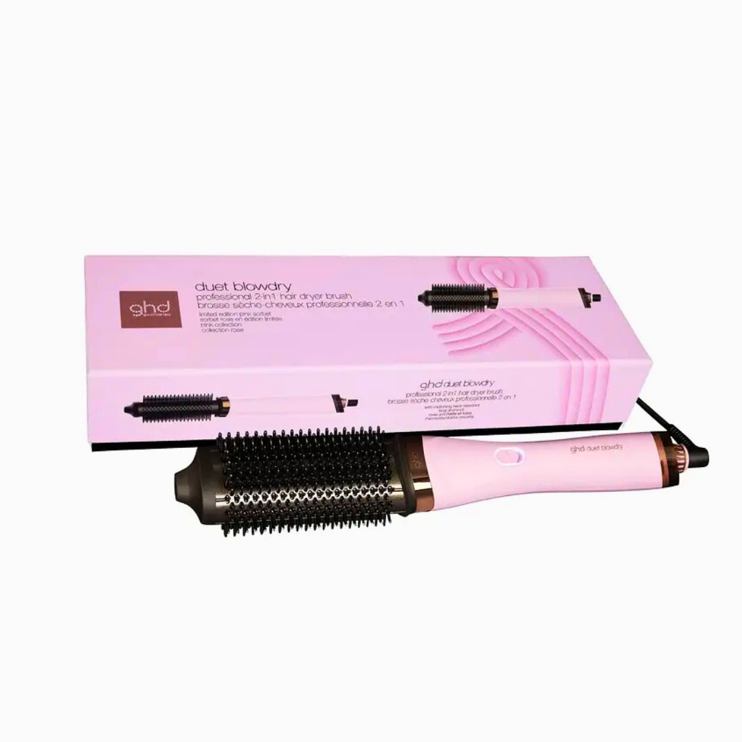 Ein pinkfarbener GHD Duet Blowdry Haartrockner-Bürste mit einem schwarzen Bürstenkopf und einer pinkfarbenen Box mit Text und Grafiken.