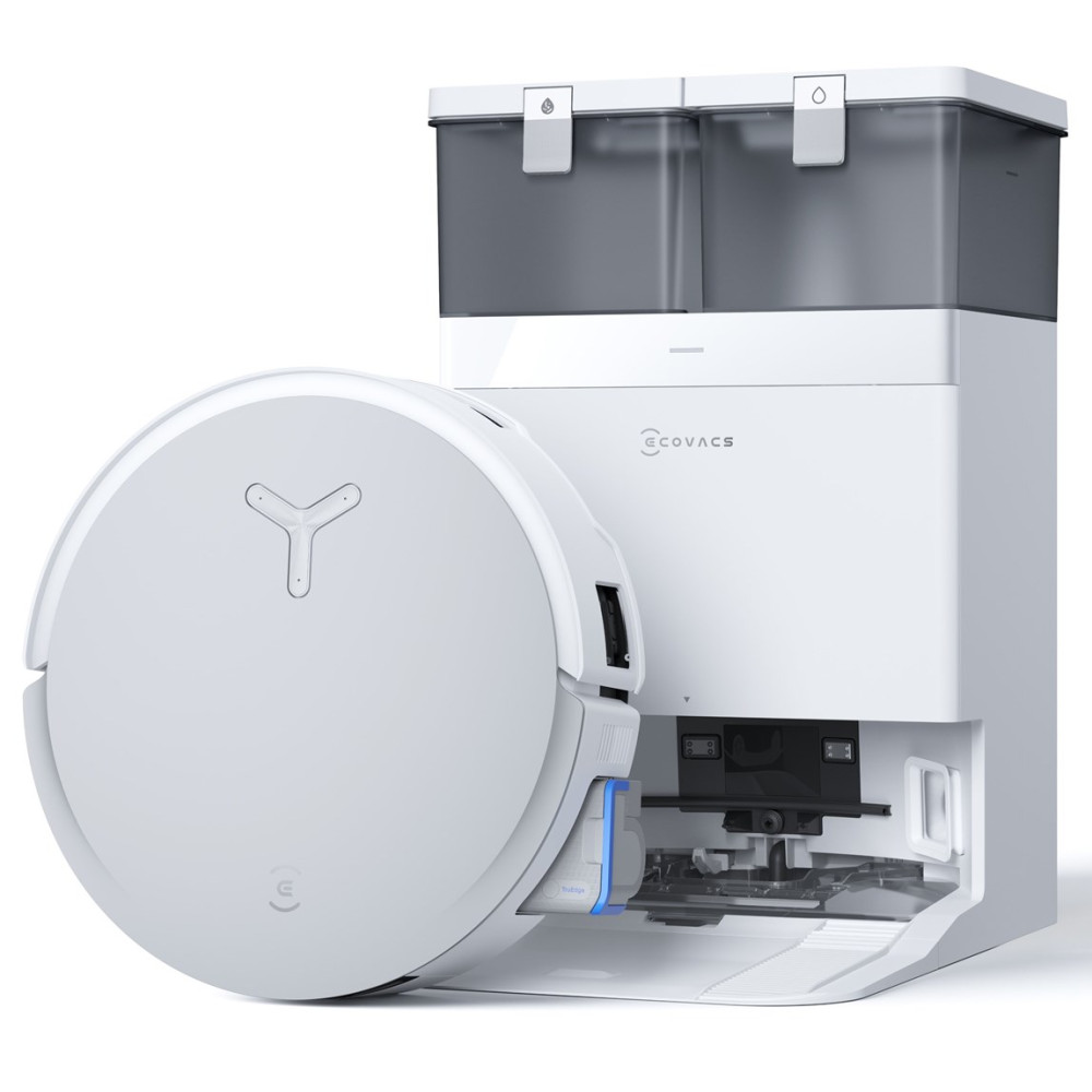 Biały odkurzacz automatyczny obok białej stacji ładującej. Stacja ma dwa ciemne pojemniki na górze.