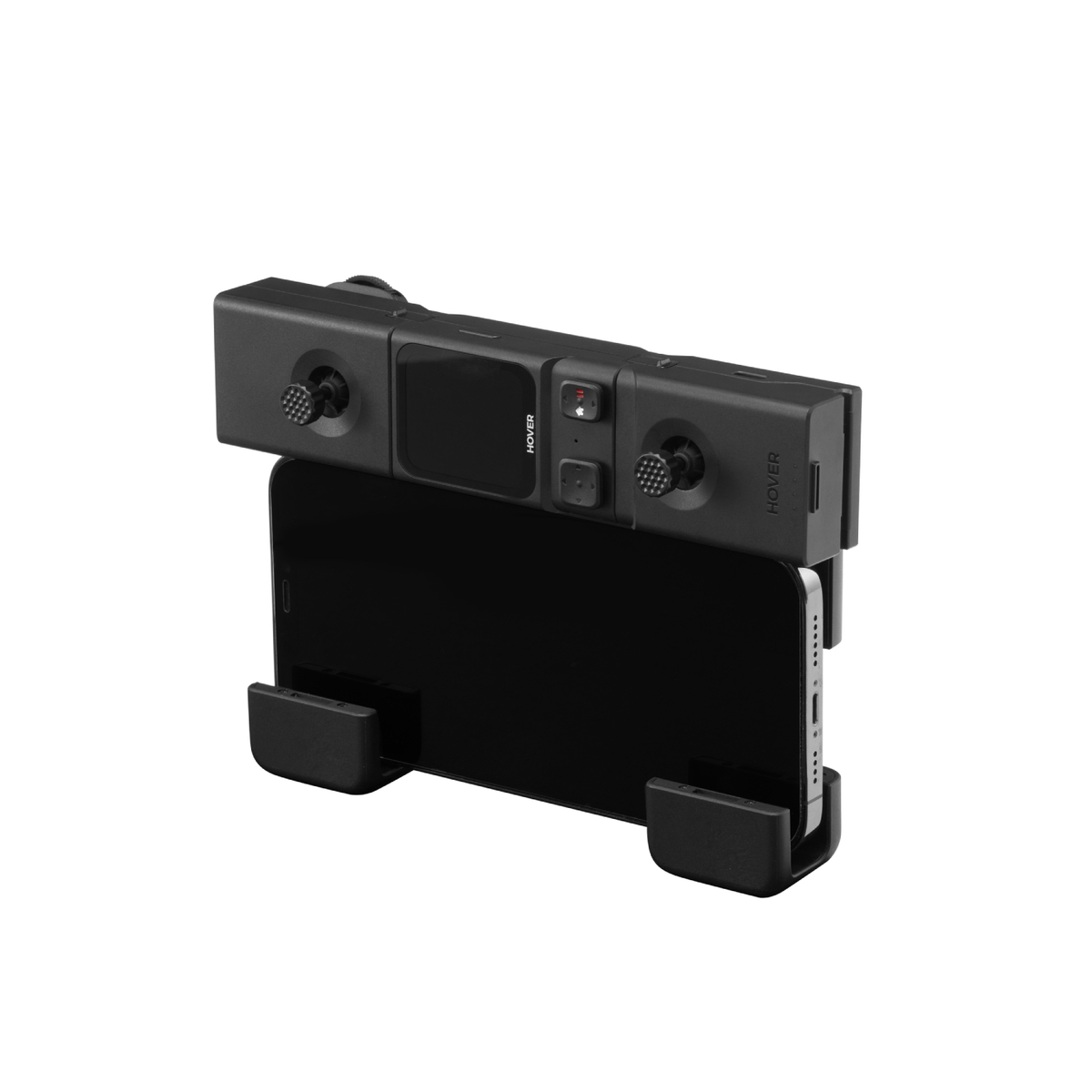 Czarny kontroler drona z joystickami, przyciskami i ekranem jest zamontowany nad czarnym smartfonem, odizolowanym na białym tle.