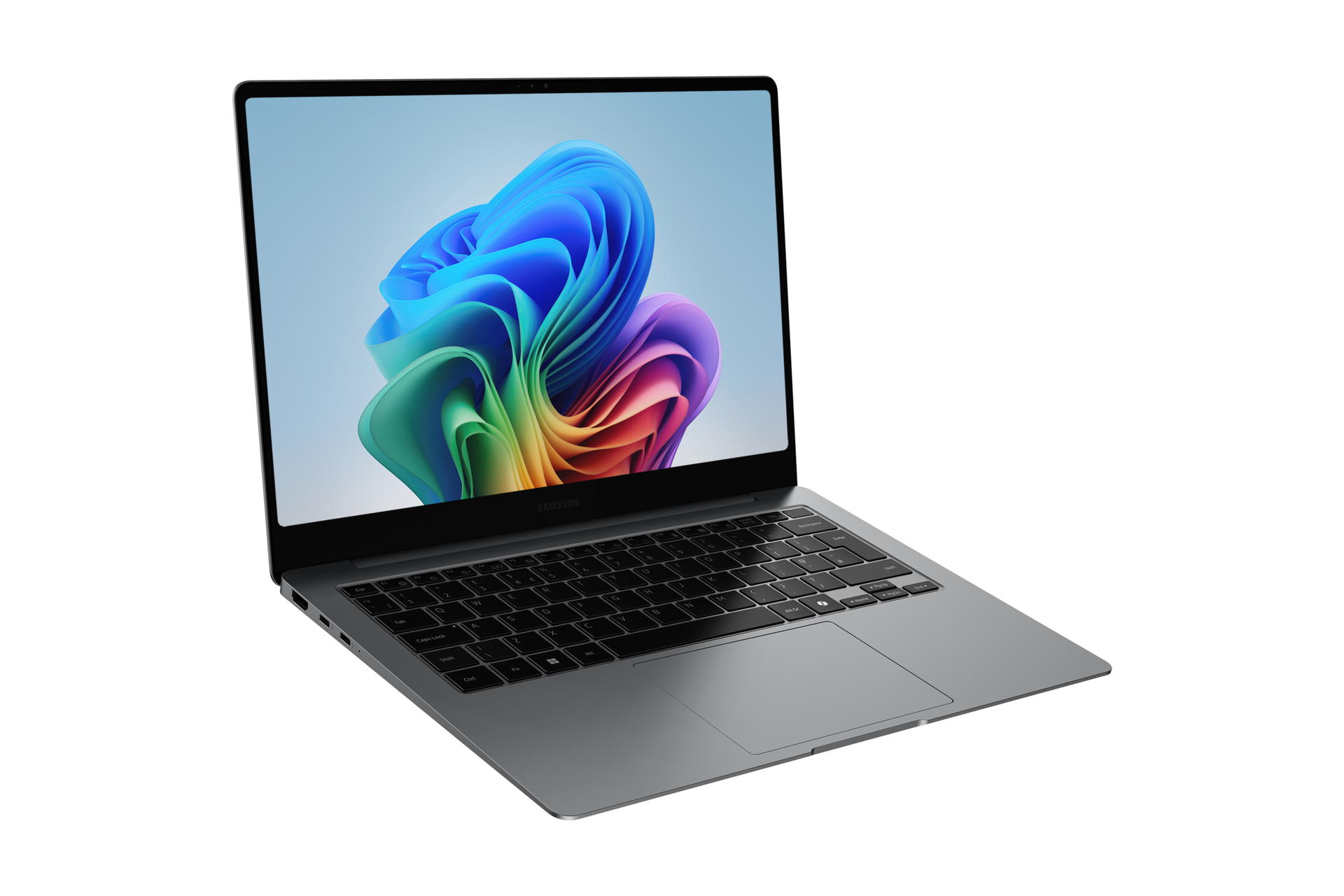 Szary laptop Samsung jest otwarty, wyświetlając kolorowy abstrakcyjny obraz na ekranie. Klawiatura jest widoczna.