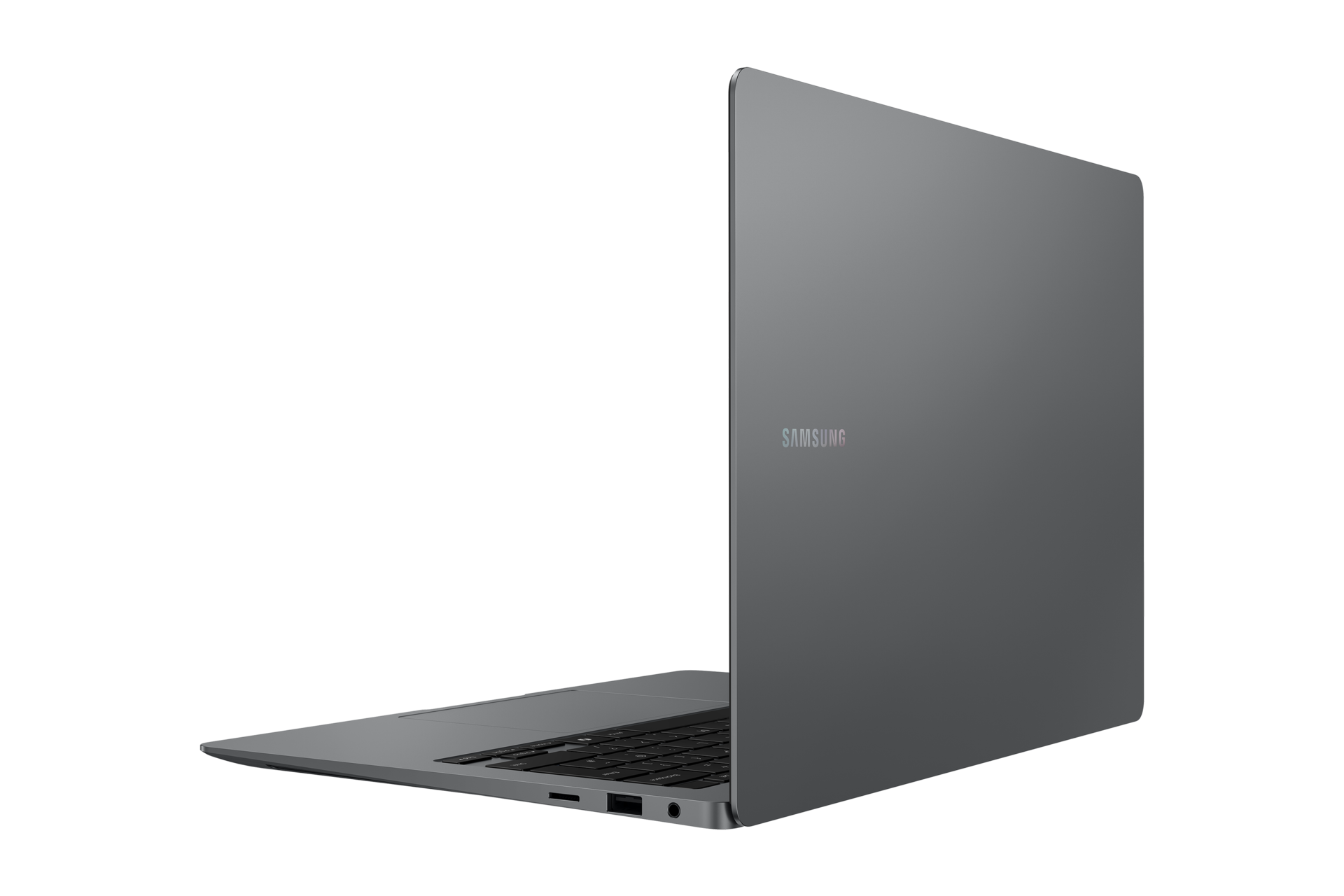 Szary laptop Samsung jest otwarty, pokazując klawiaturę i porty. Ekran jest widoczny z logo Samsung.