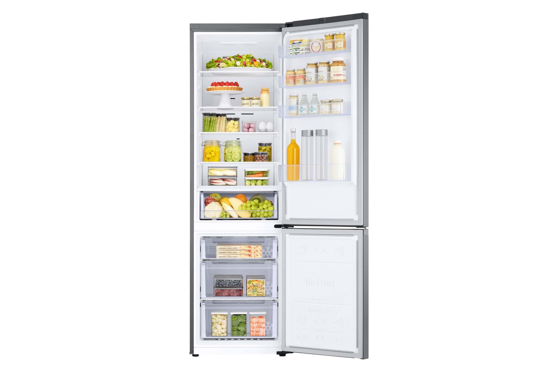 Frigorifero aperto pieno di frutta, verdura e altri alimenti. Include un congelatore no-frost.