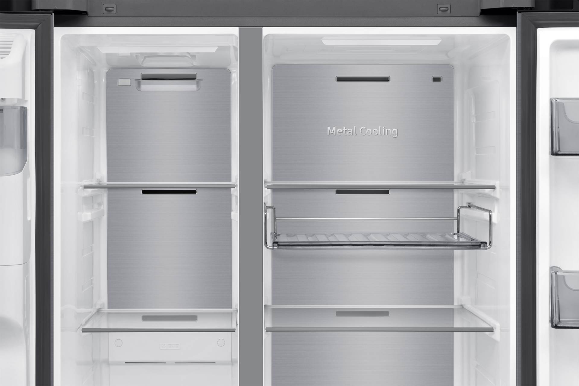An open refrigerator interior with metal cooling panels, glass shelves, and a metal wire rack.