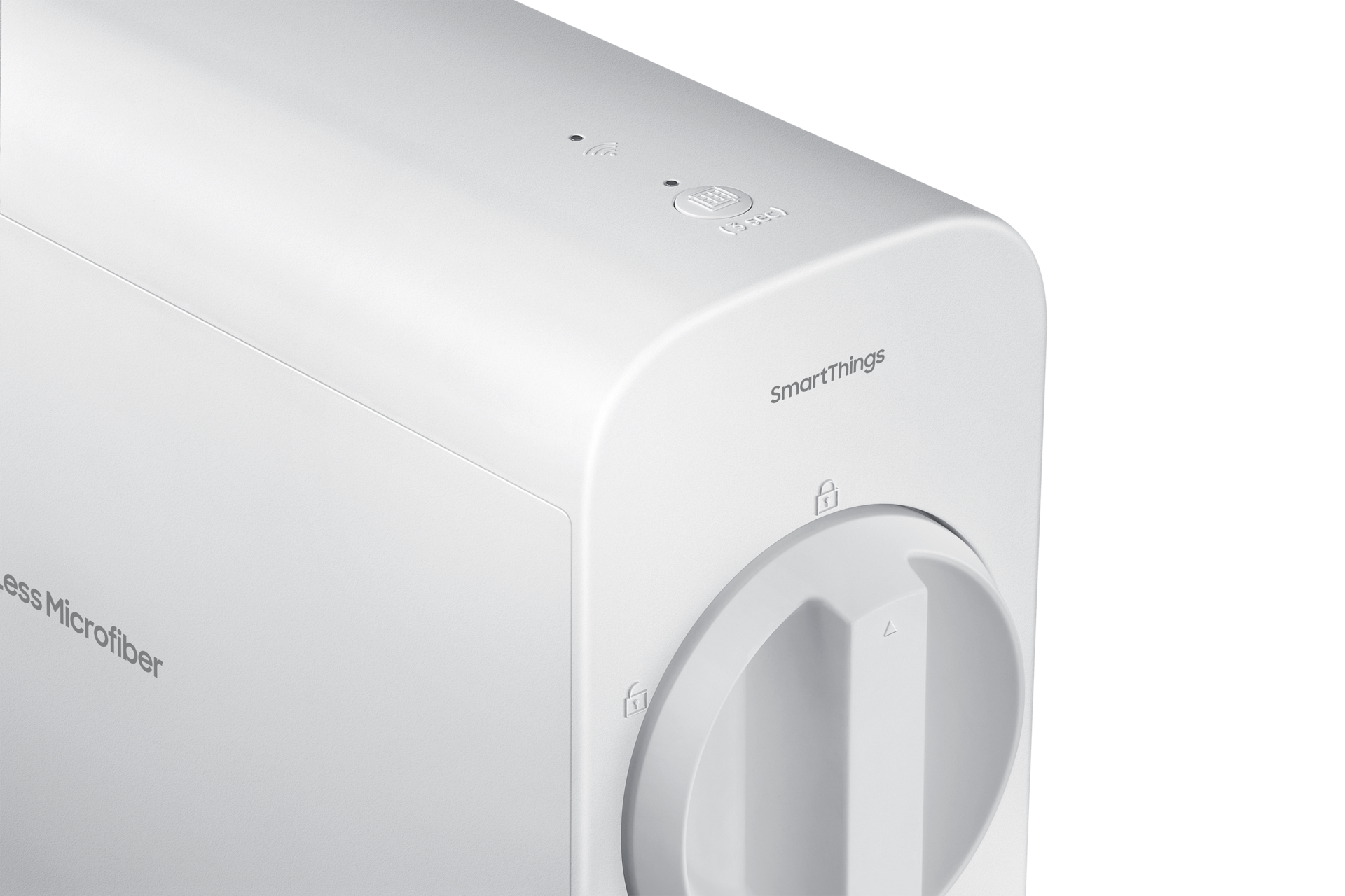 Primer plano de un dispositivo SmartThings blanco. Tiene un dial, un botón y el logotipo de SmartThings. El fondo es negro.