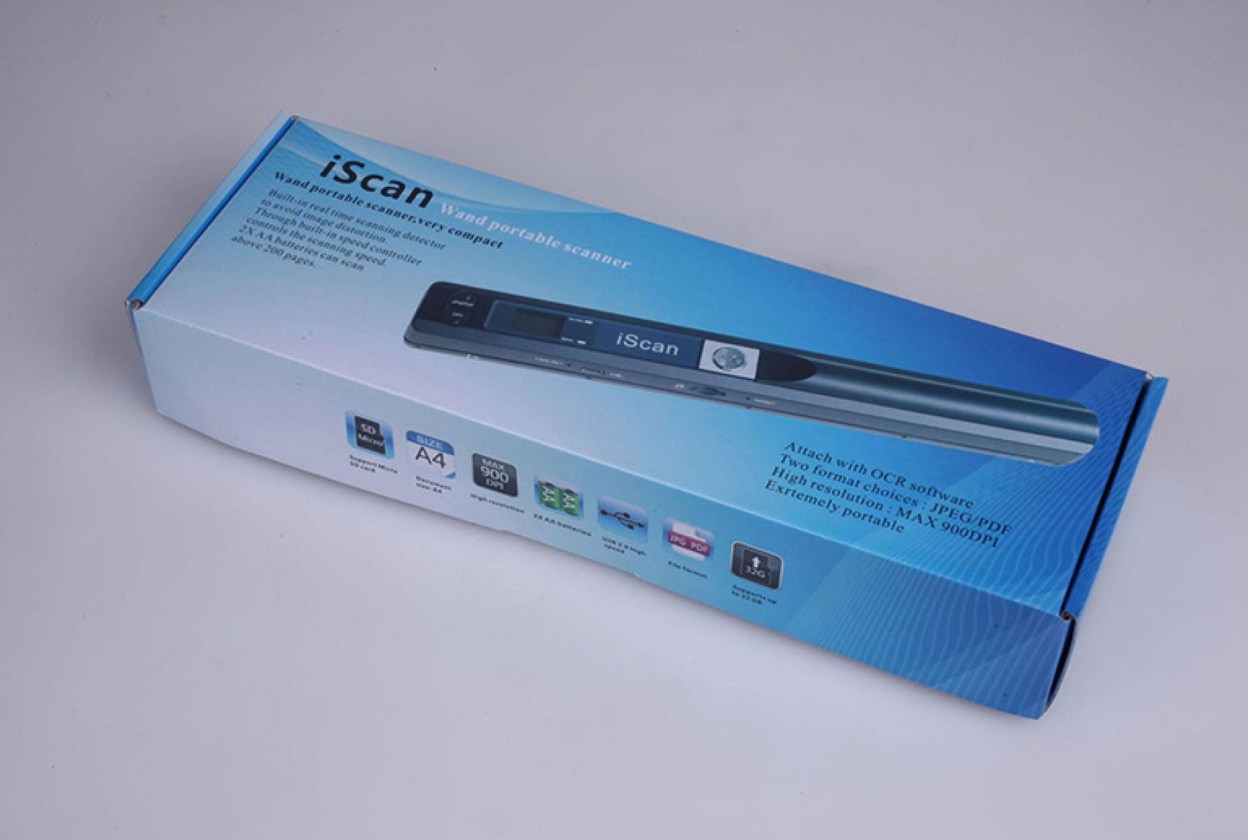 Das Bild zeigt einen iScan-Stab-Scanner in seiner Verpackung. Die Schachtel ist weiß und blau, mit Produktdetails und Funktionen.