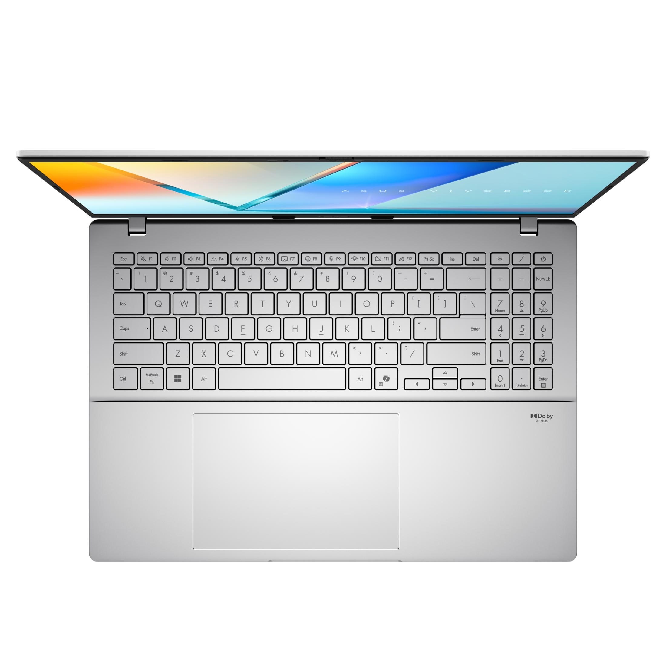 Srebrny laptop jest otwarty, pokazując klawiaturę i ekran. Ekran wyświetla kolorowy obraz.