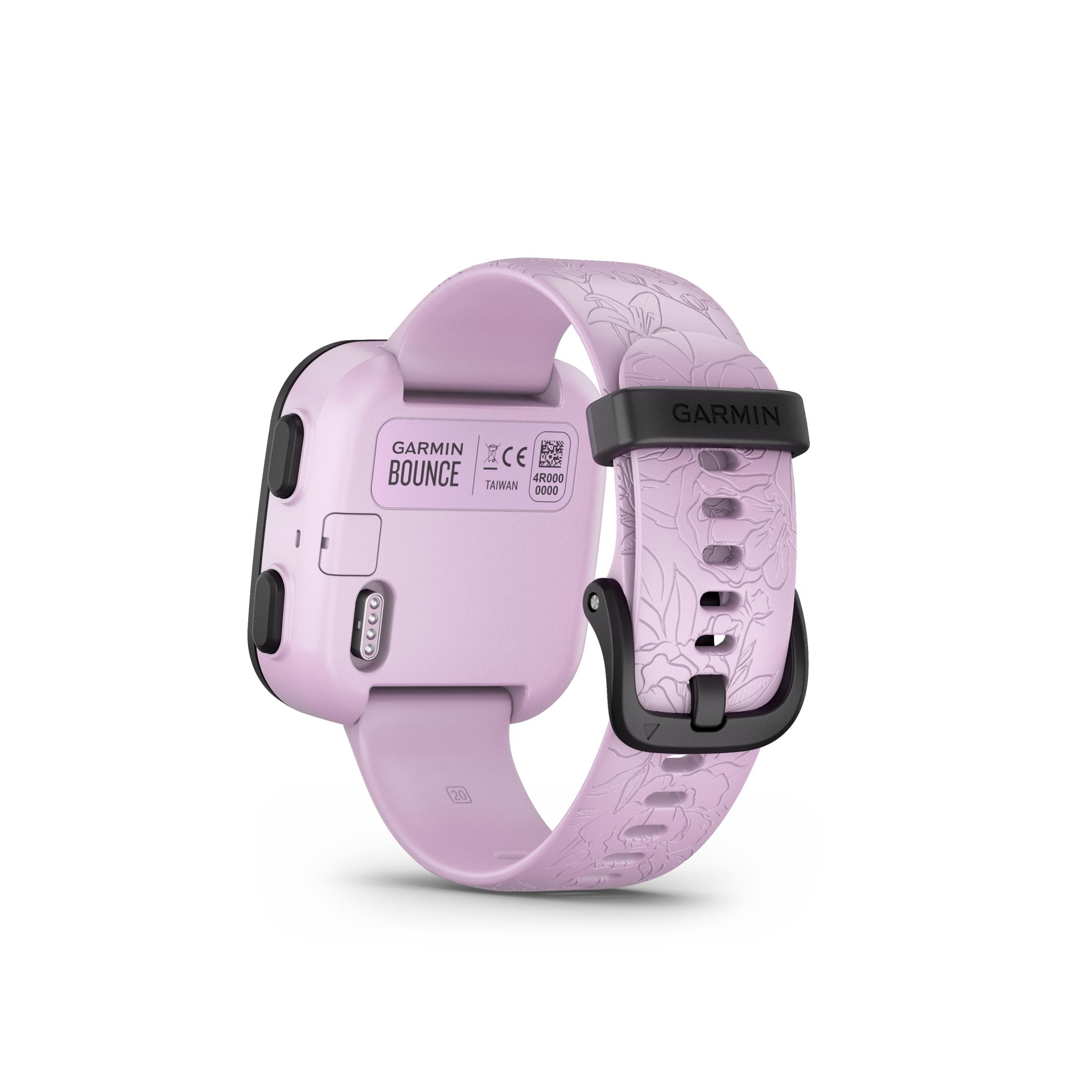 Smartwatch Garmin Bounce, jasnofioletowy z kwiatowym paskiem. Czarne akcenty na tarczy i klamrze. Białe tło.