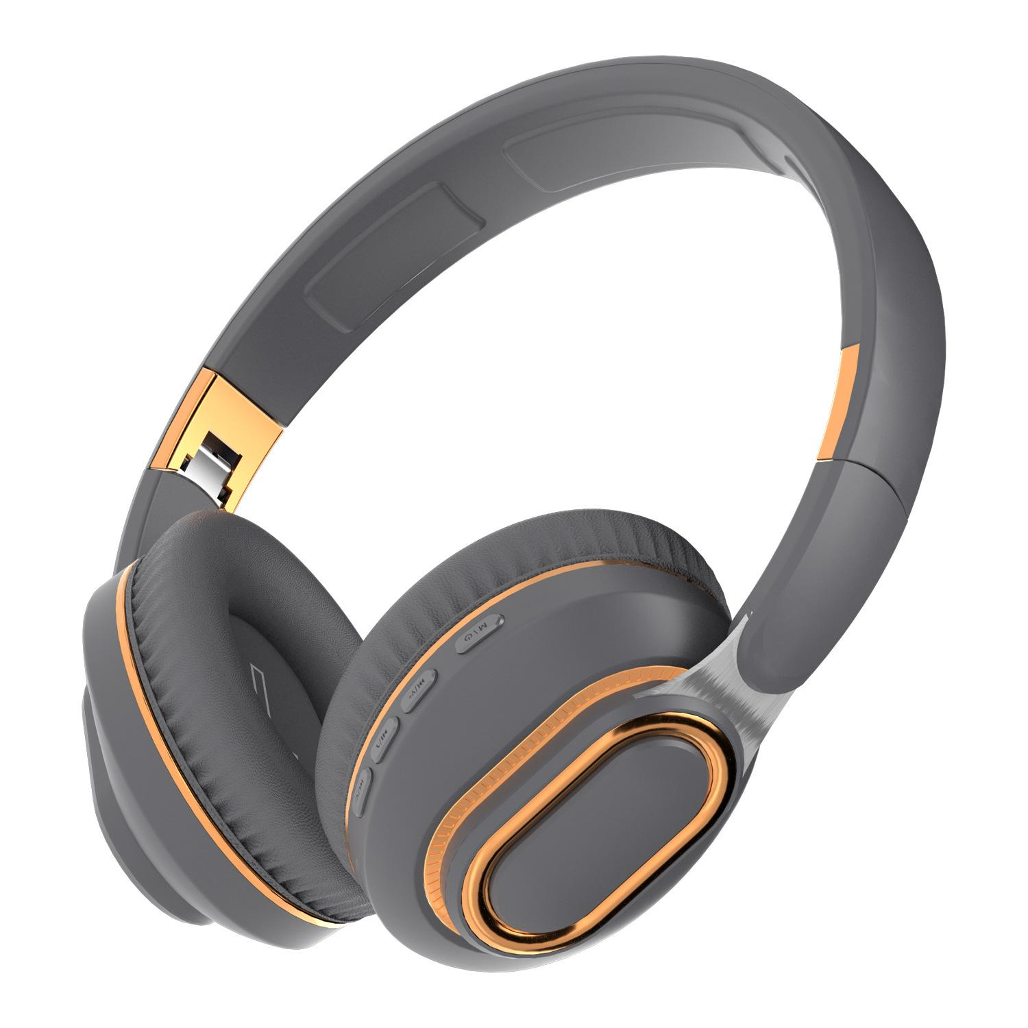 Grau-goldene Kopfhörer. Die Over-Ear-Kopfhörer haben ein gepolstertes Kopfband und Ohrmuscheln mit goldenen Akzenten. Knöpfe sind auf der rechten Ohrmuschel sichtbar.