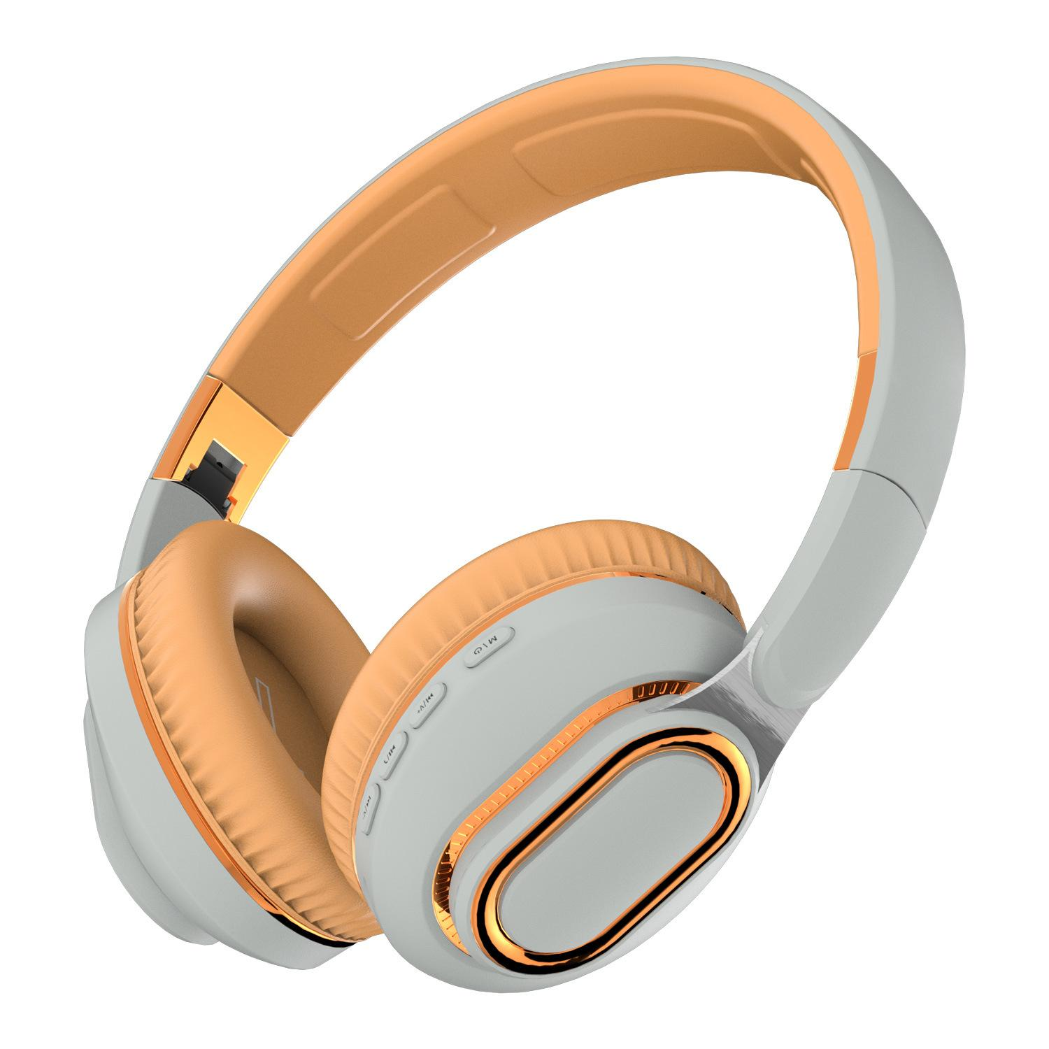 Kopfhörer in Weiß und Orange. Die Ohrmuscheln sind orangefarben, mit einem goldenen Rand. Das Kopfband ist weiß mit orangefarbenen Akzenten.