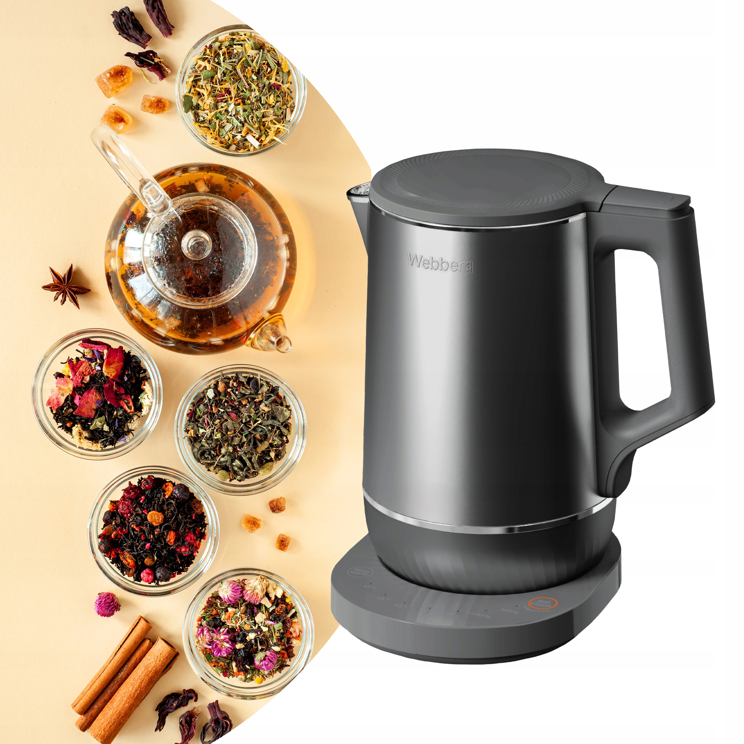 Nowoczesny czarny czajnik elektryczny obok składników herbaty: ziół, liści herbaty, przypraw i szklanego dzbanka.