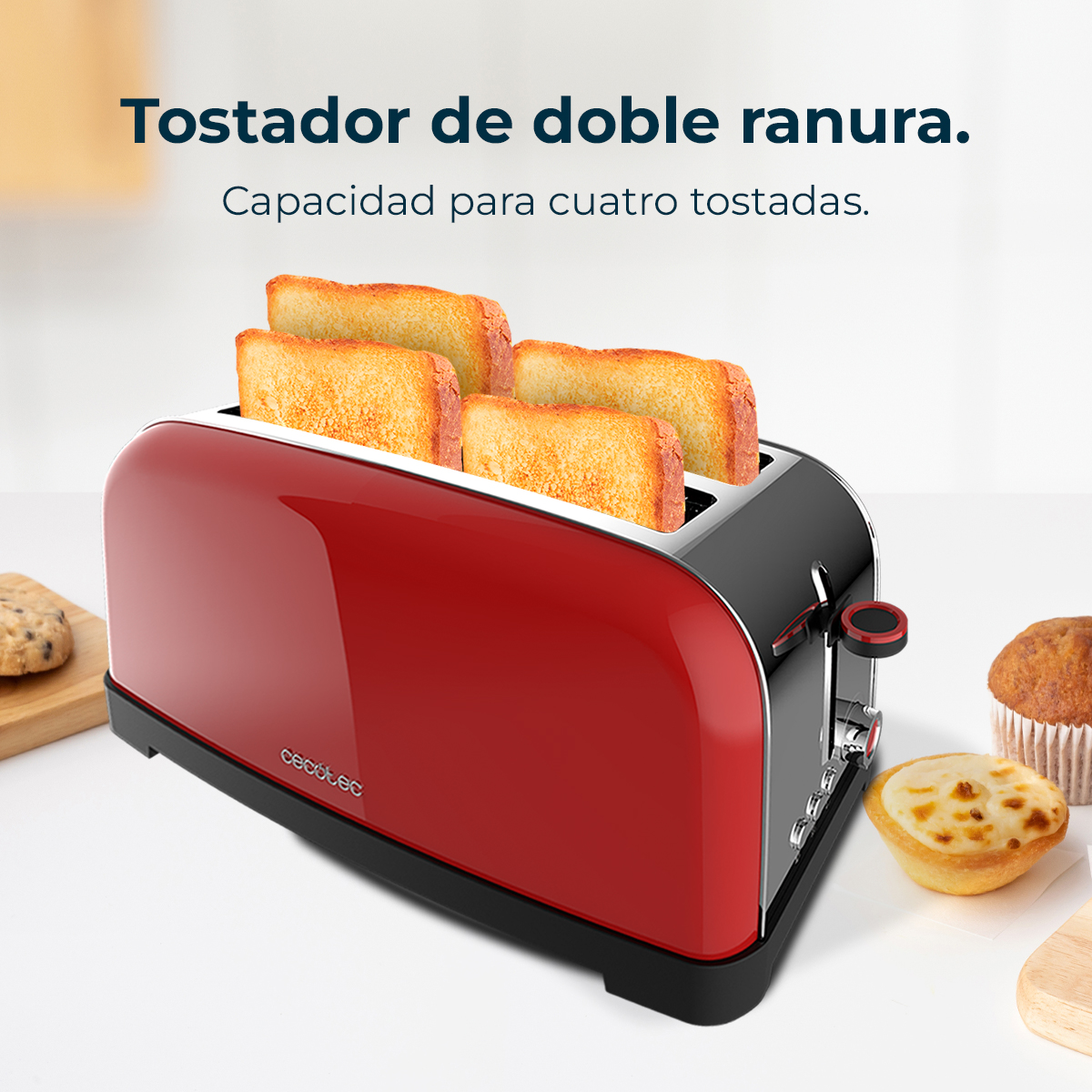 Un tostapane rosso e nero con quattro fette di pane tostato. Accanto ci sono un biscotto, un muffin e un pasticcino.