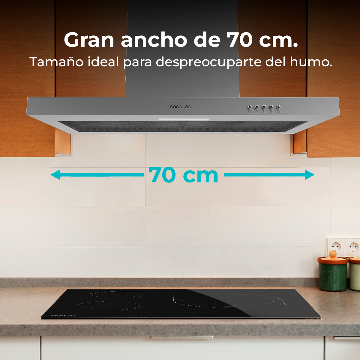 Escena de cocina con una campana extractora de 70 cm sobre una encimera negra. El texto dice 'Gran ancho de 70 cm' y 'Tamaño ideal'.