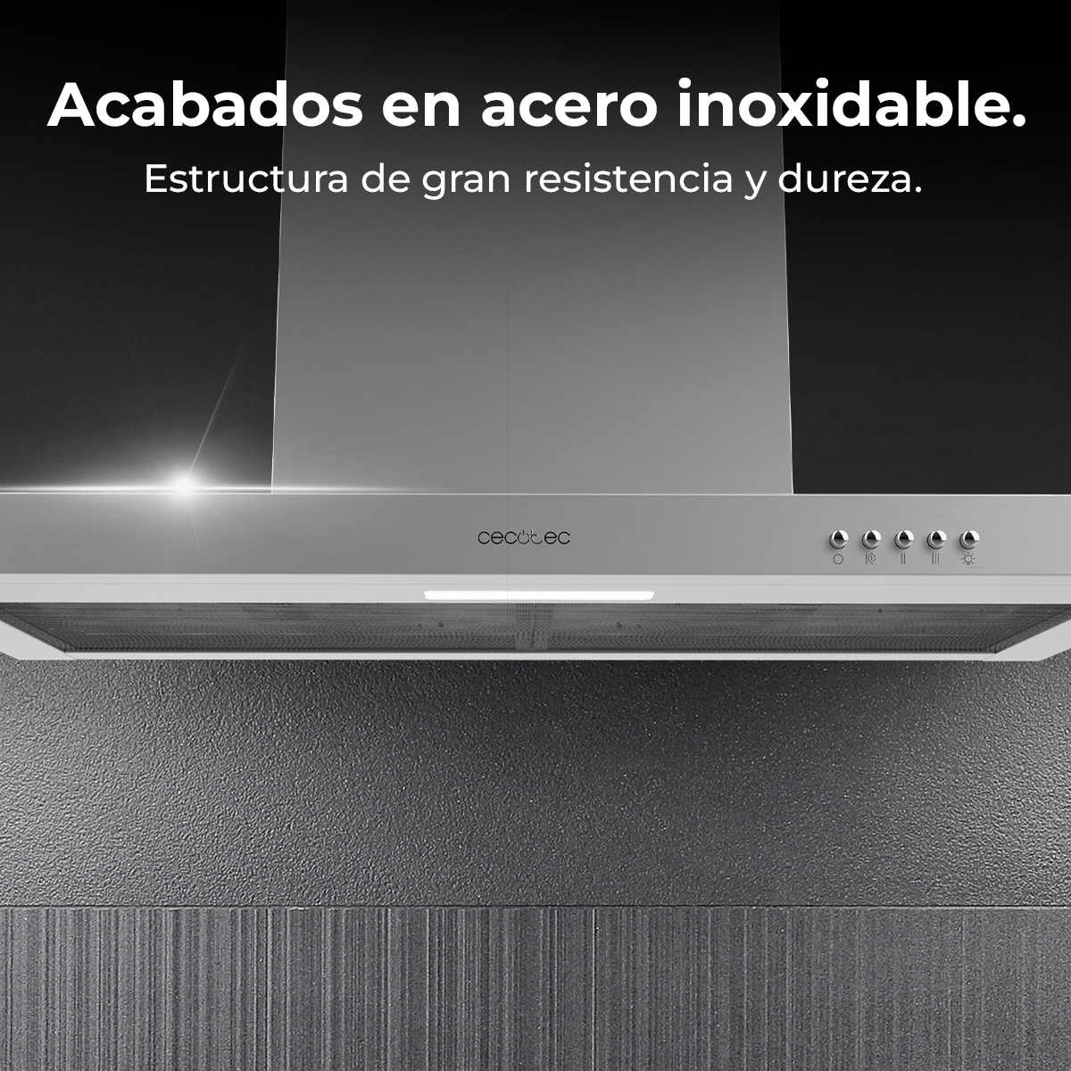 Campana extractora de acero inoxidable con controles, sobre una superficie gris oscuro texturizada. Texto: 'Acabados en acero inoxidable'.