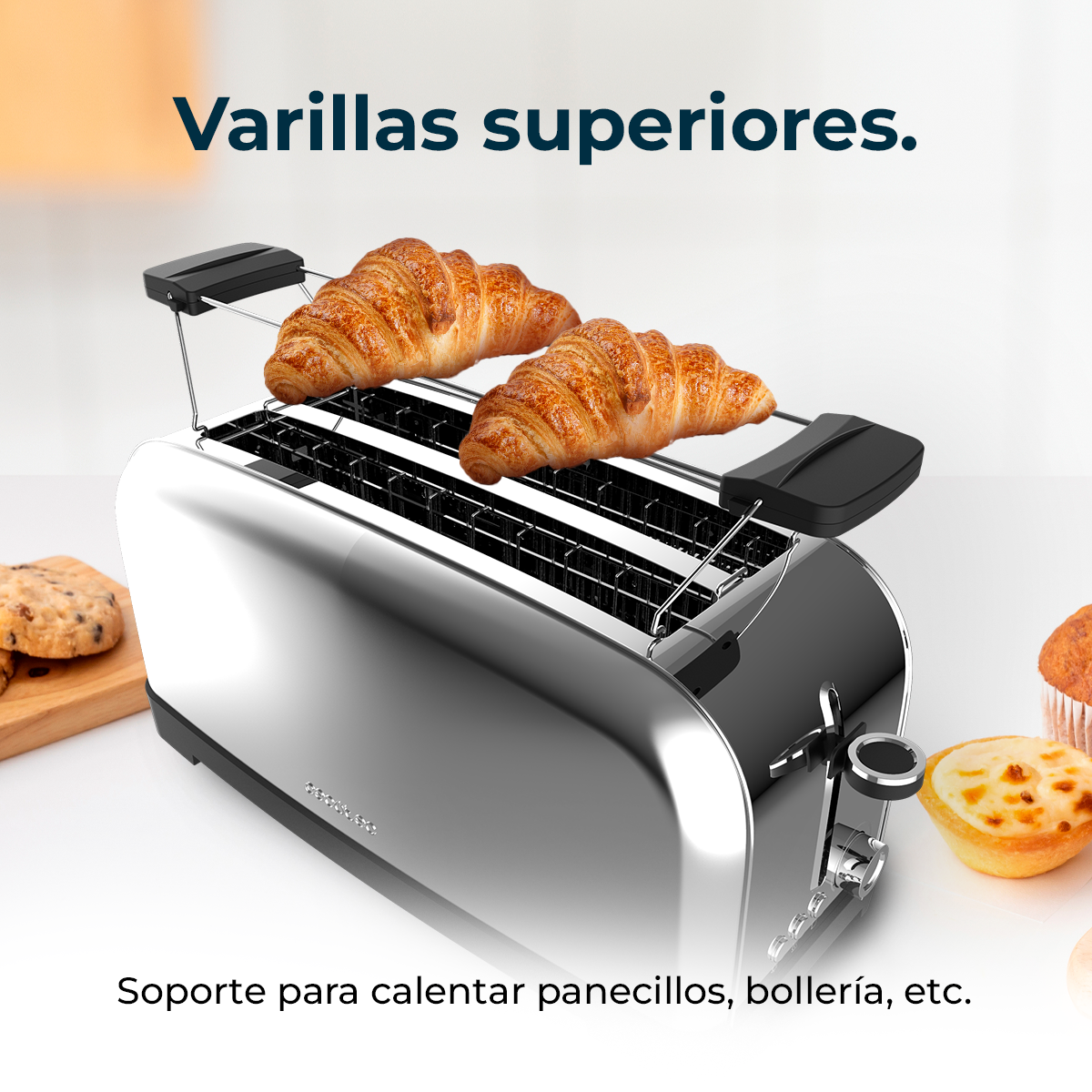 Un tostapane cromato con due croissant sopra. Altri pasticcini sono ai lati. Il testo recita 'Griglie superiori' e 'Supporto per scaldare panini, ecc.'