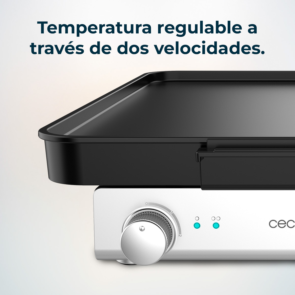 Black griddle on white base. It has a knob and two indicator lights. Text: Temperature adjustable through two speeds.