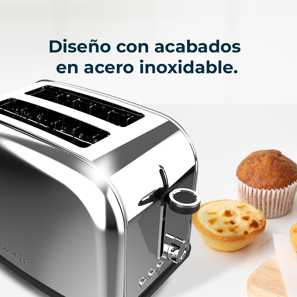 Ein glänzender Toaster aus Edelstahl mit Muffins und Törtchen auf einer weißen Oberfläche. Text: 'Design mit Edelstahl-Finish'.