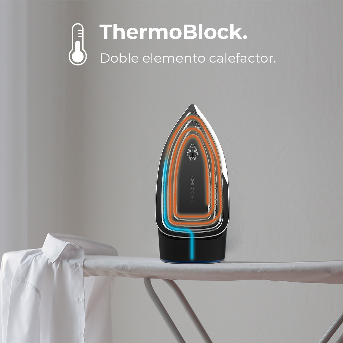 Żelazko na desce do prasowania. Żelazko pokazuje przekrój z pomarańczowymi i niebieskimi elementami grzewczymi. Po lewej białej koszuli.