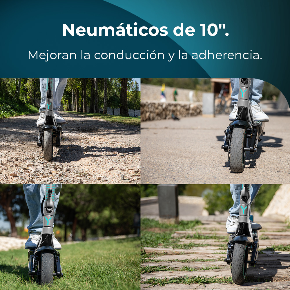 Persona montando un patinete eléctrico en varias superficies: camino de tierra, asfalto, hierba y pasarela de madera. El patinete tiene llantas grandes.