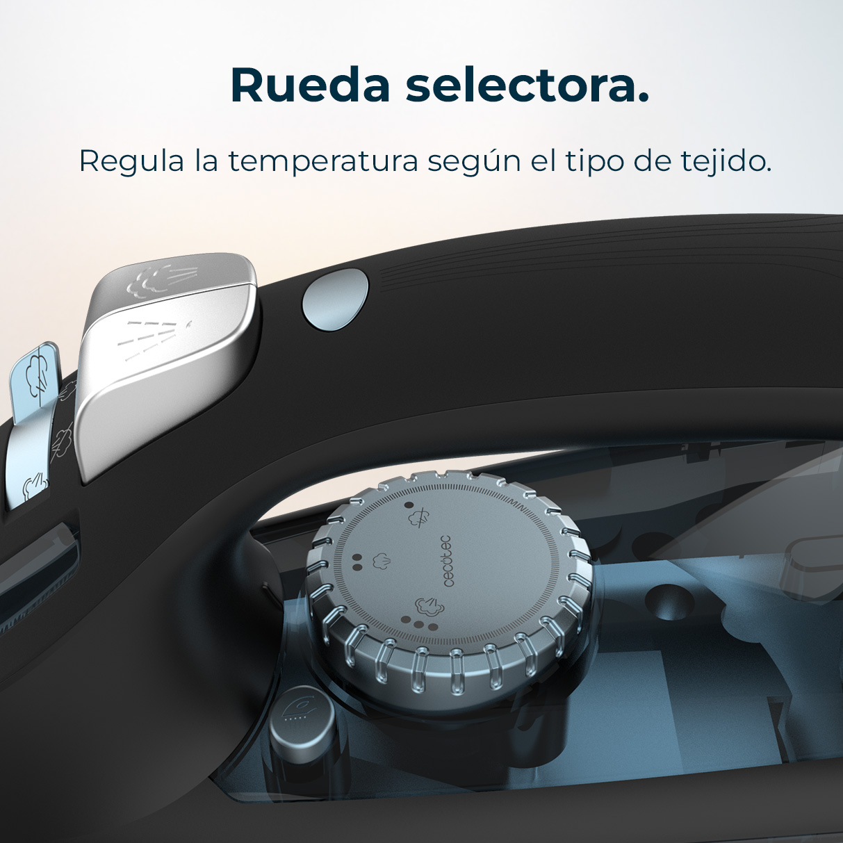 Close-up of a black and silver iron. A dial with steam icons is visible. The text says: 'Rueda selectora. Regula la temperatura según el tipo de tejido.'