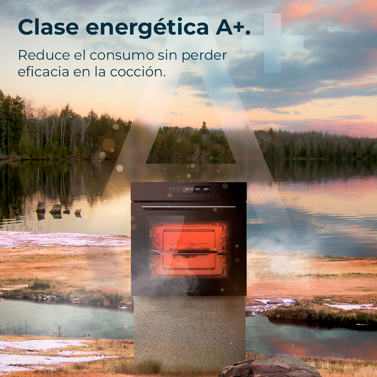 Un horno con interior rojo frente a un lago al atardecer. El texto dice 'clase energética A+' y 'reduce el consumo'.