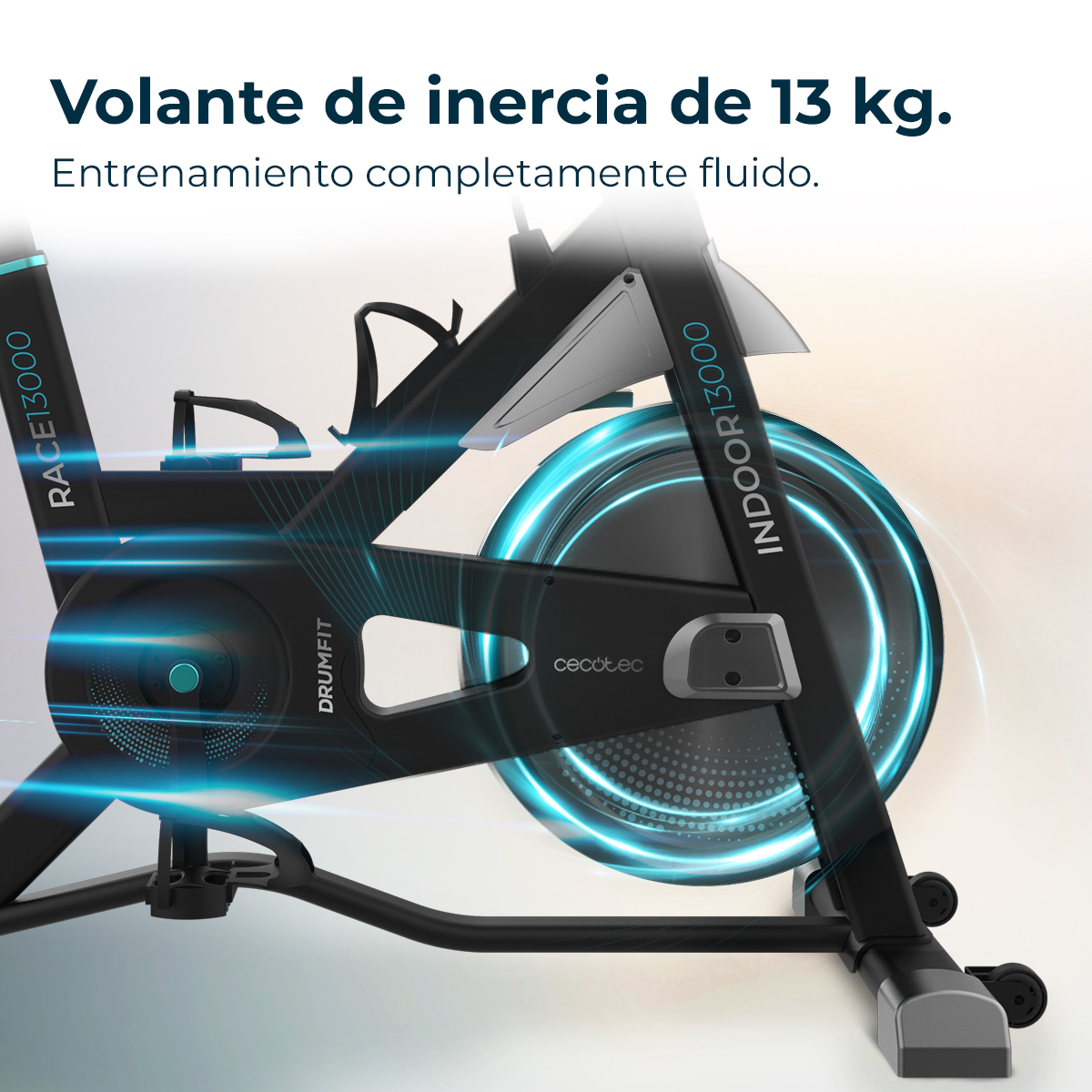 Bicicletta da camera nera con volano e portaborraccia. Testo: 'Volante de inercia de 13 kg'.