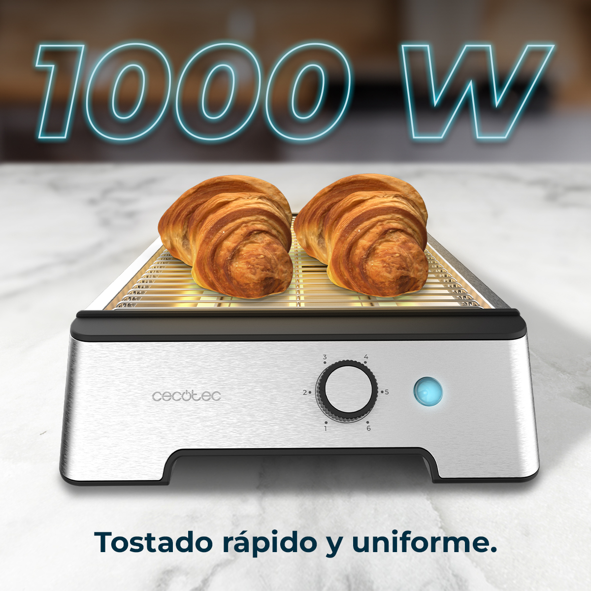 Dos cruasanes en una tostadora, con un indicador de potencia. El texto '1000 W' está arriba y 'Tostado rápido y uniforme' abajo.