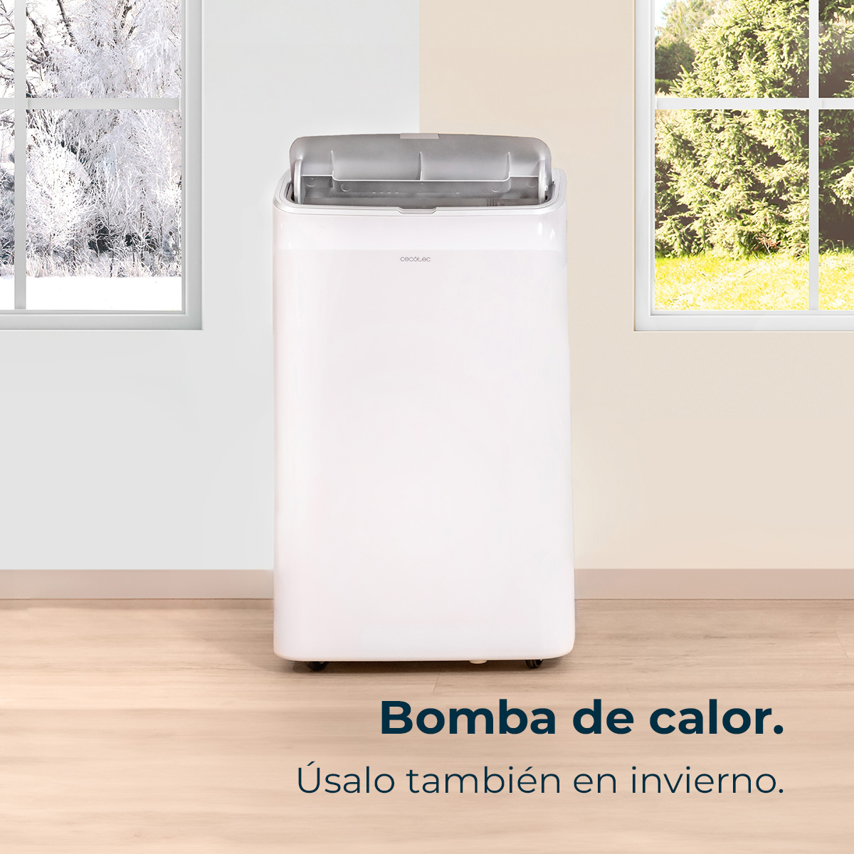 Biały klimatyzator na drewnianej podłodze. Okna pokazują zimowe i letnie sceny. Tekst: pompa ciepła, używaj również zimą.