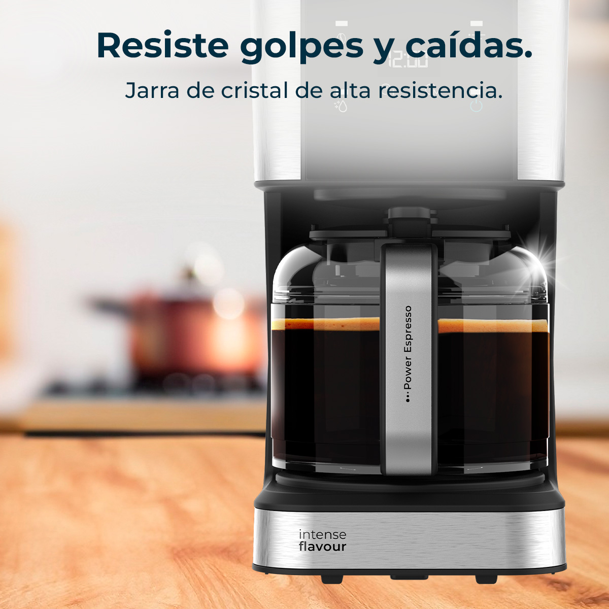 Ekspres do kawy ze szklaną karafką wypełnioną kawą. Tekst brzmi 'Resiste golpes y caídas' i 'Intense flavour'.