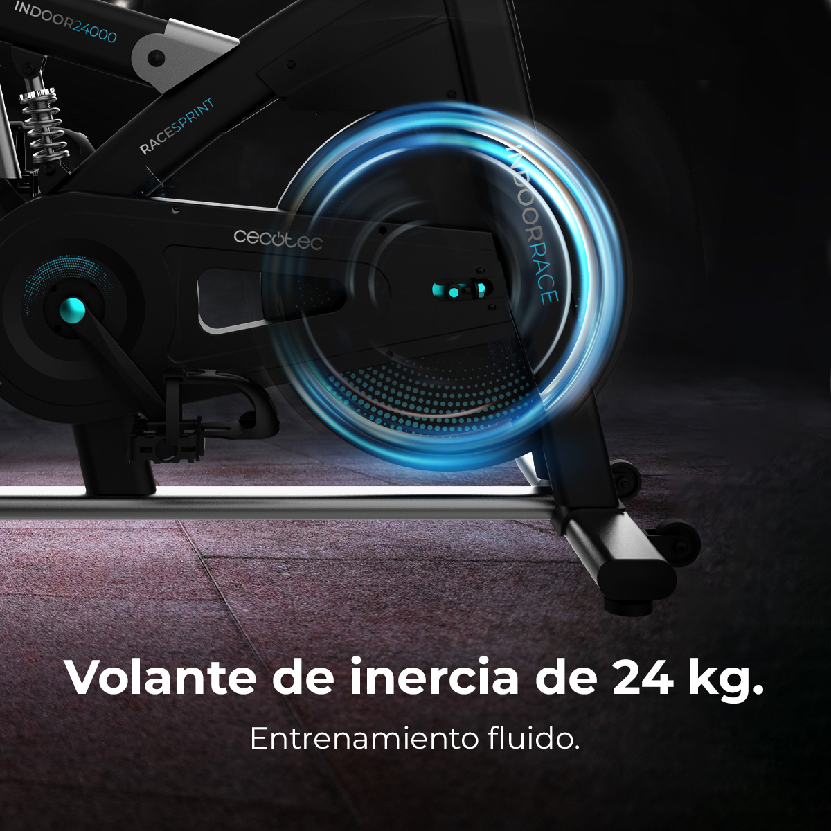 Una bicicleta estática negra con volante azul brillante. El texto dice 'Volante de inercia de 24 kg' y 'Entrenamiento fluido'.