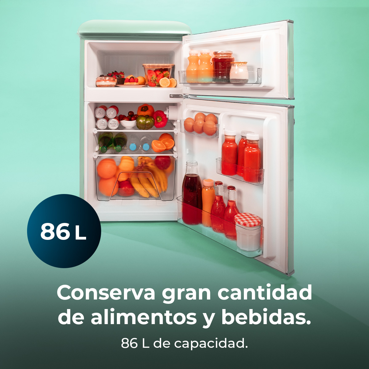 Miętowa zielona lodówka jest otwarta, ukazując owoce, napoje i inne produkty spożywcze. Niebieskie koło pokazuje '86 L'. Tekst mówi...