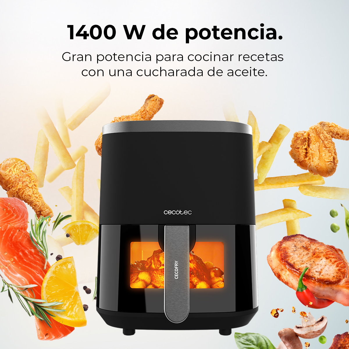 Una freidora de aire con alimentos como pollo, papas fritas y salmón. El texto dice '1400 W de potencia', y 'cecotec' es visible.