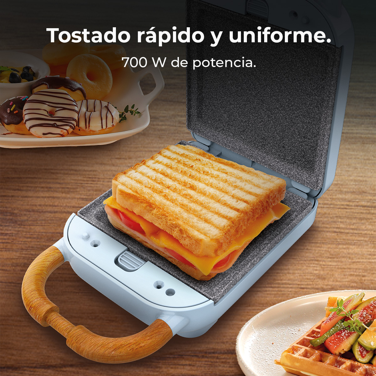 Tostadora con sándwich tostado dentro. Donas y gofres a un lado. El texto dice 'Tostado rápido y uniforme'.