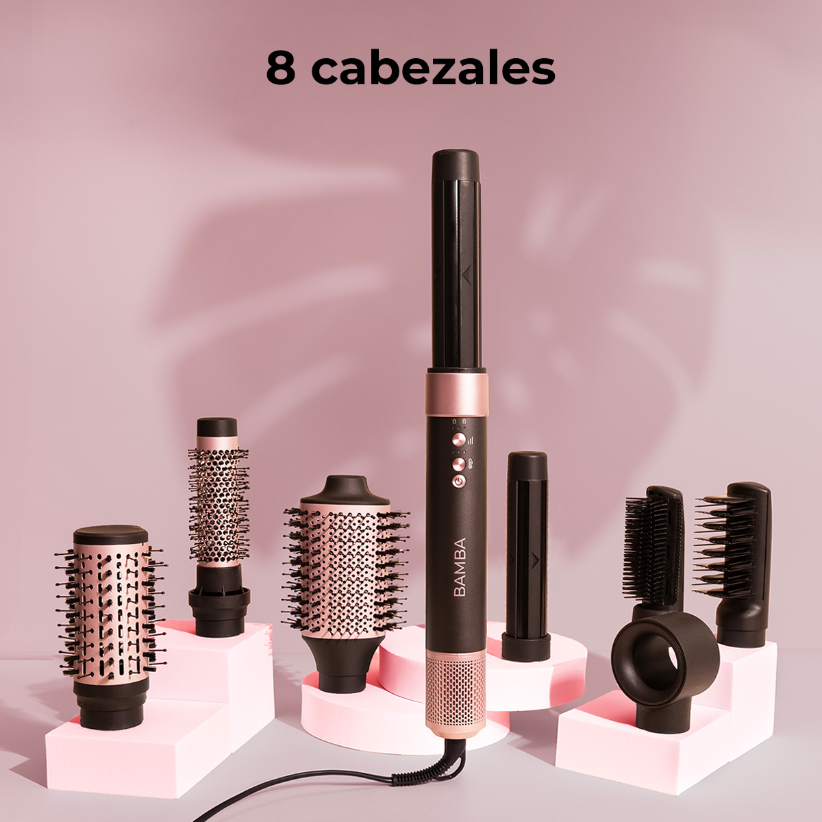 Haarstyling tools set: Een centraal zwart apparaat met roségouden accenten wordt omringd door diverse borstelkoppen.