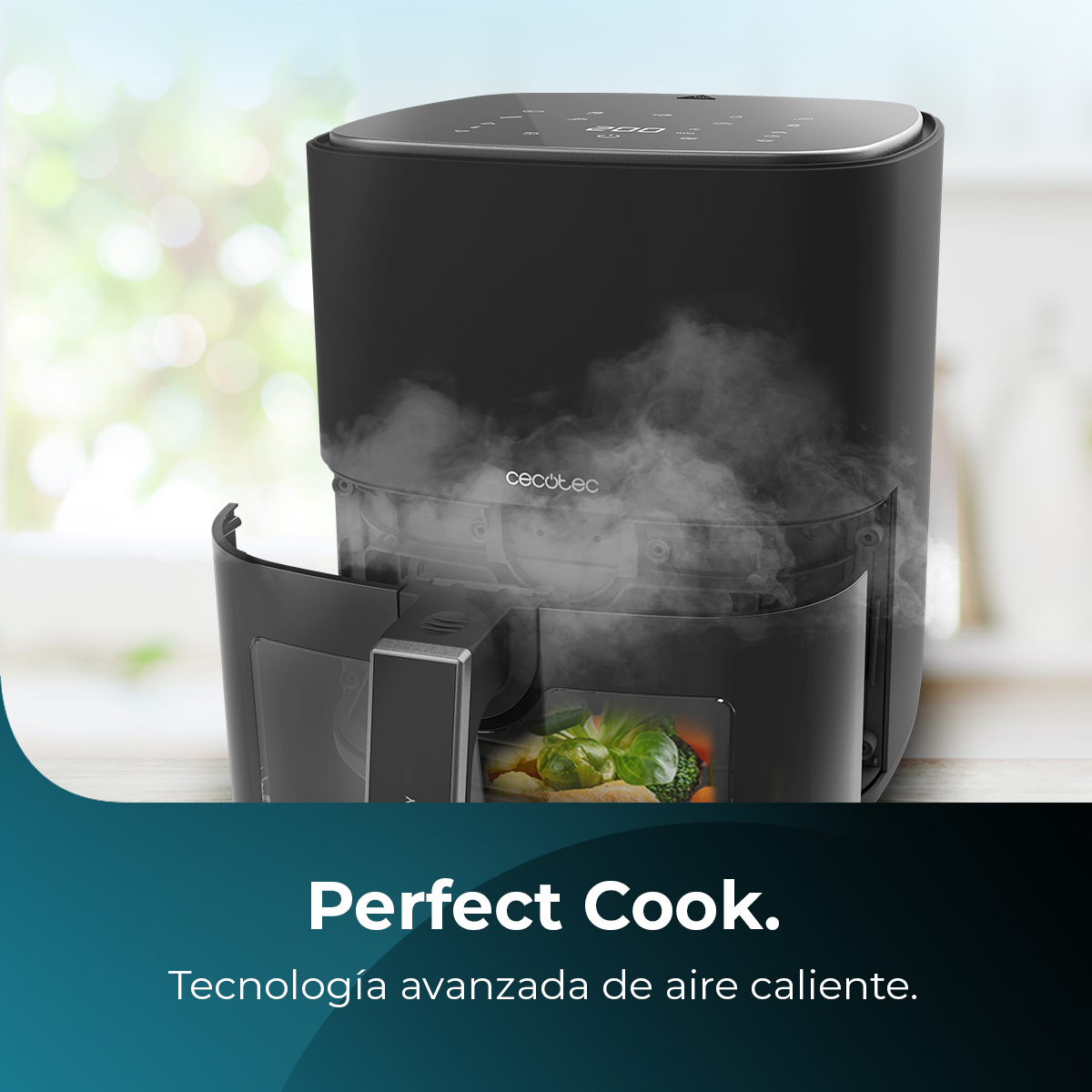 Una freidora de aire negra con vapor que sale del cajón abierto, que contiene verduras. El texto dice 'Perfect Cook'.