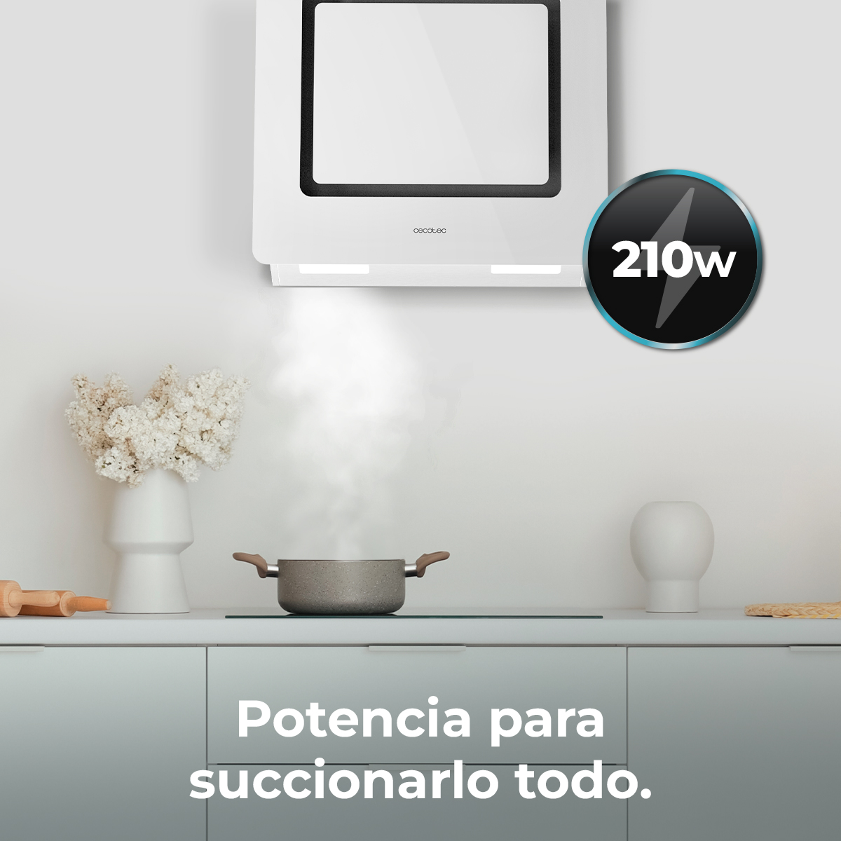 Una campana extractora blanca sobre una olla en una placa. El vapor sale de la olla. El texto dice 'Potencia para succionarlo todo'.