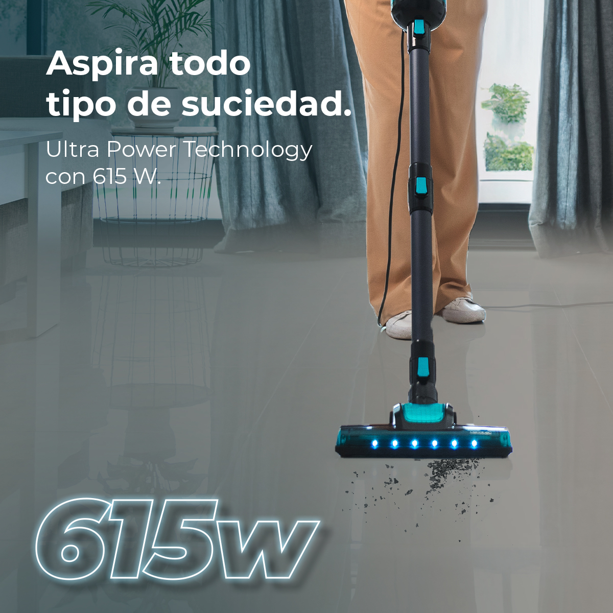 A person vacuums a gray floor with a black and teal vacuum. Text reads, 'Aspira todo tipo de suciedad,' and '615w'.