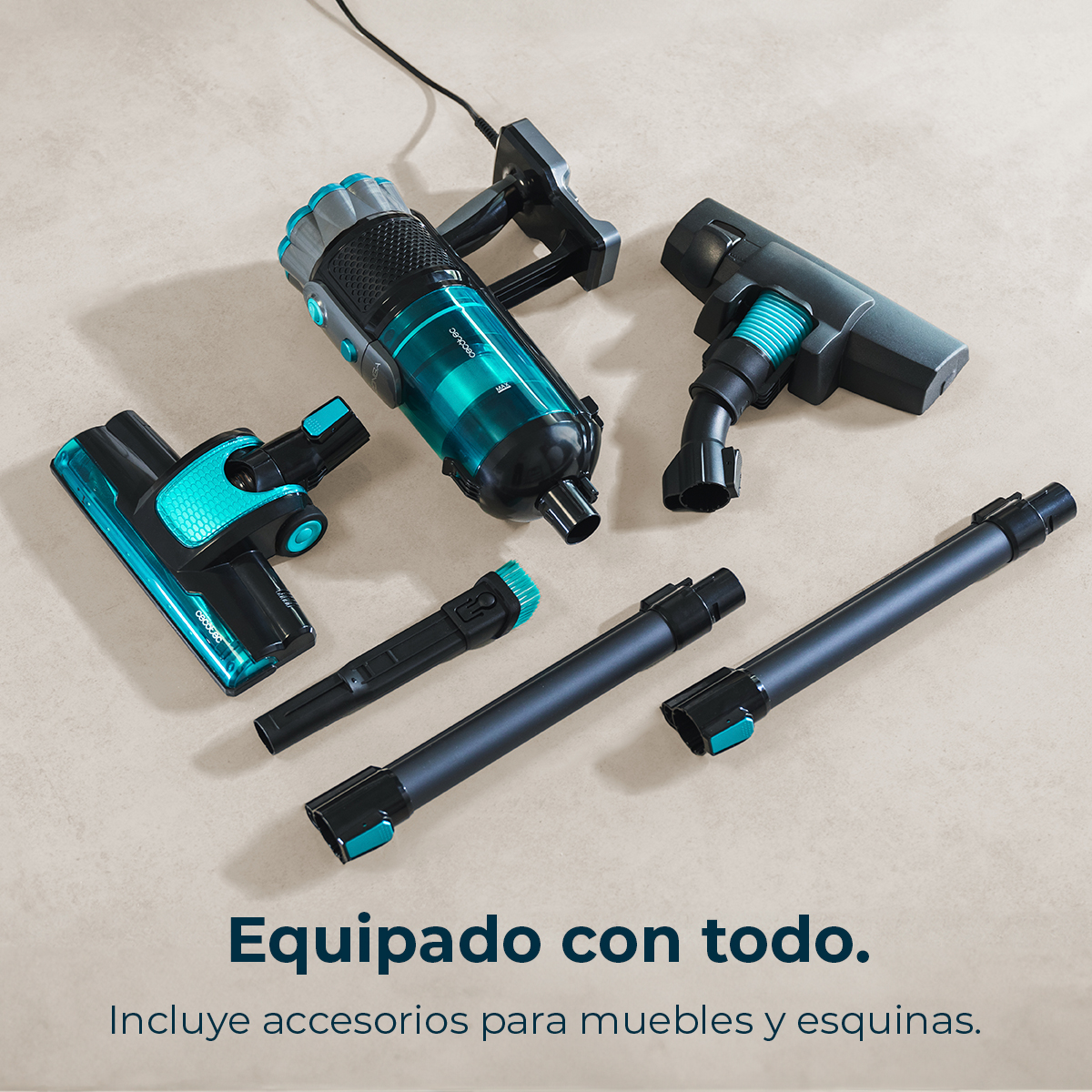 Vacuum cleaner and attachments. Main unit is black and teal, accessories include brushes and extension tubes. Text: Equipped with everything.