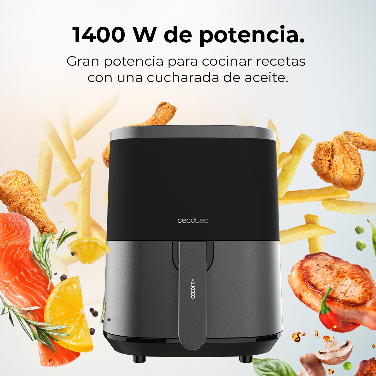 Una freidora de aire con alimentos como pollo y patatas fritas alrededor. Texto: 1400 W de potencia. Gran potencia para cocinar recetas.