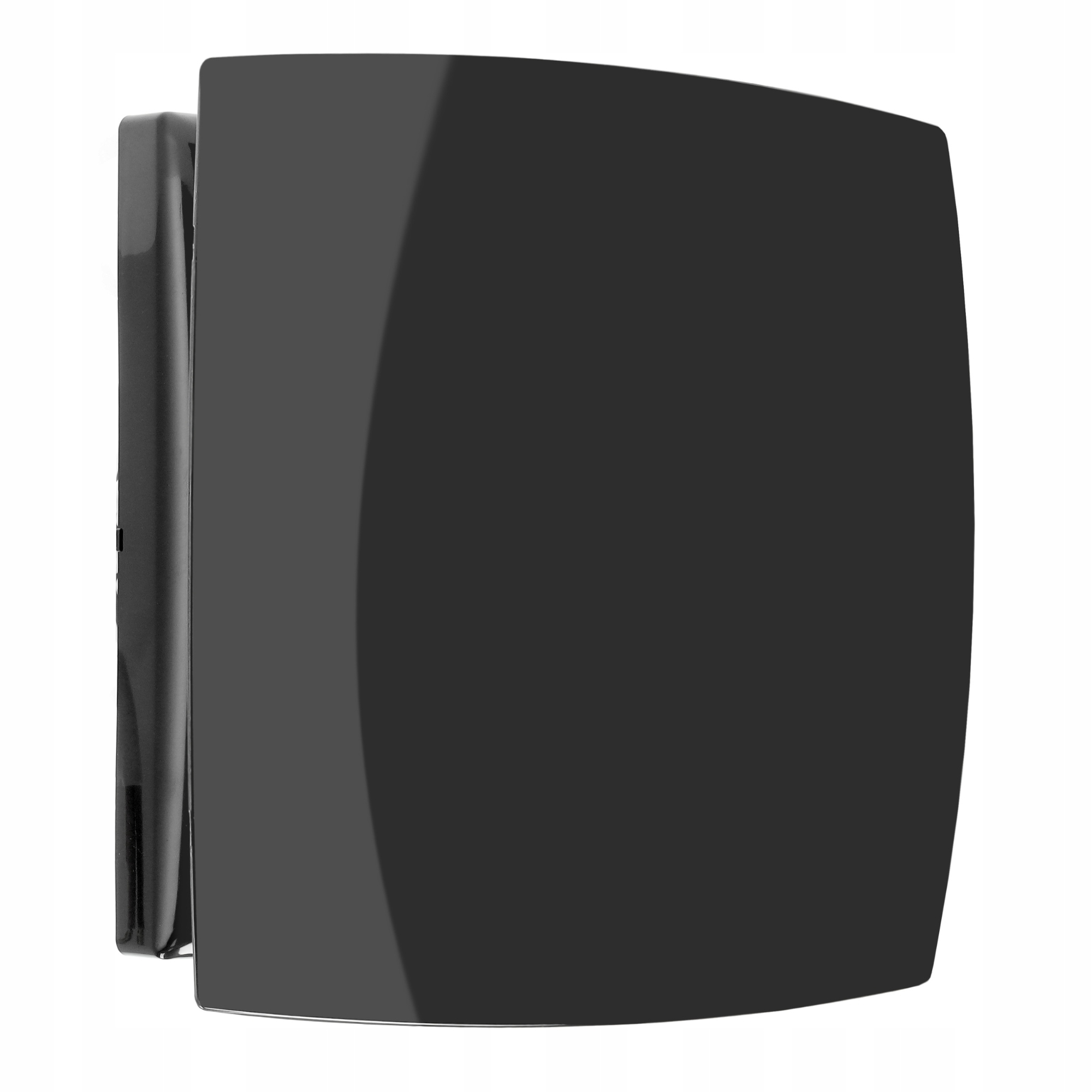 Czarny, kwadratowy obiekt z zaokrąglonymi rogami, zamontowany na białej powierzchni. Odbija światło.