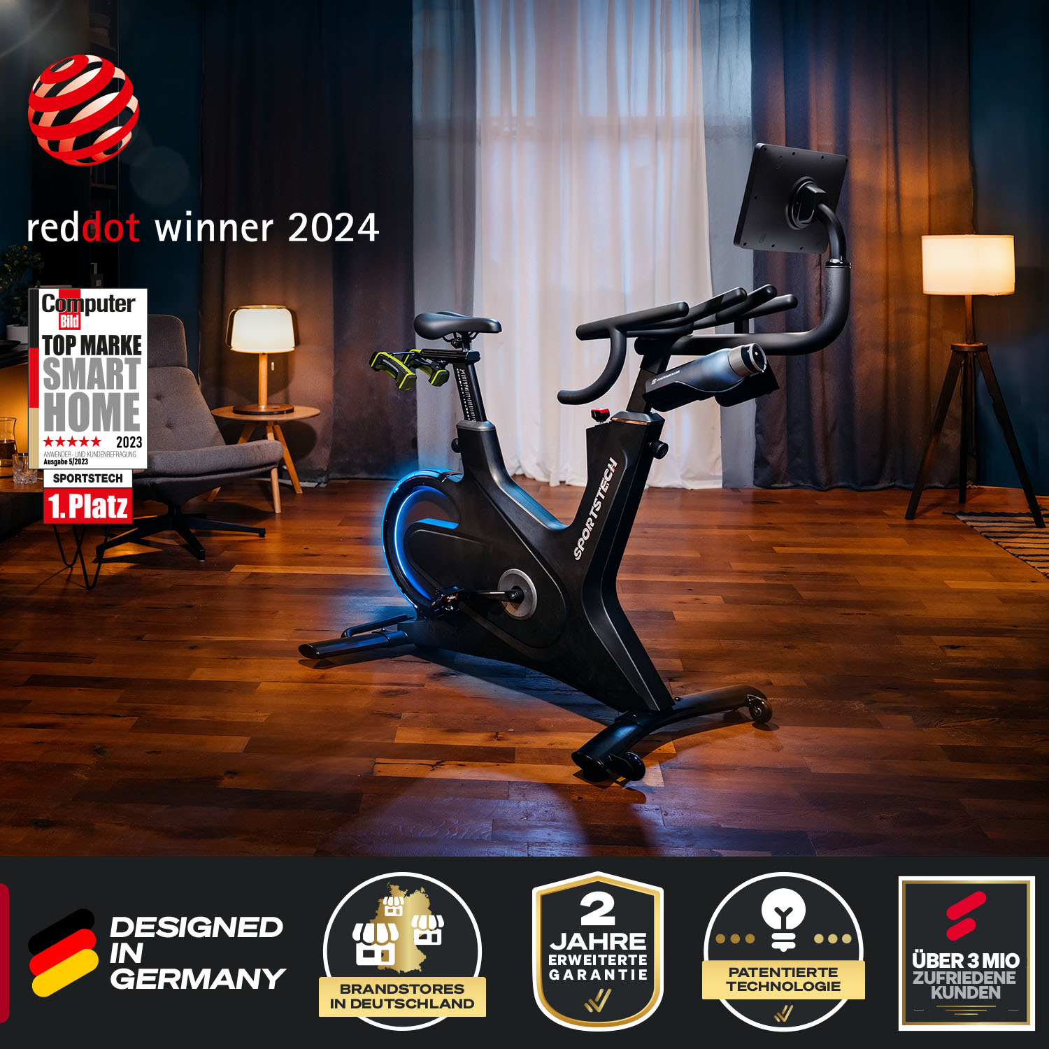 Schwarzes Sportstech-Heimtrainer, Red Dot-Gewinner 2024, in einem Raum mit Auszeichnungen und einer Lampe.