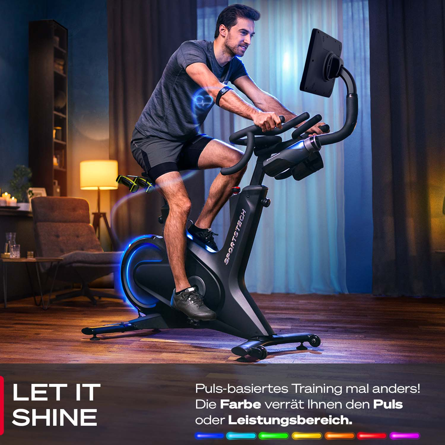 Ein Mann trainiert auf einem Heimtrainer. Das Fahrrad hat blaue Lichter. Der Mann trägt einen Herzfrequenzmesser.