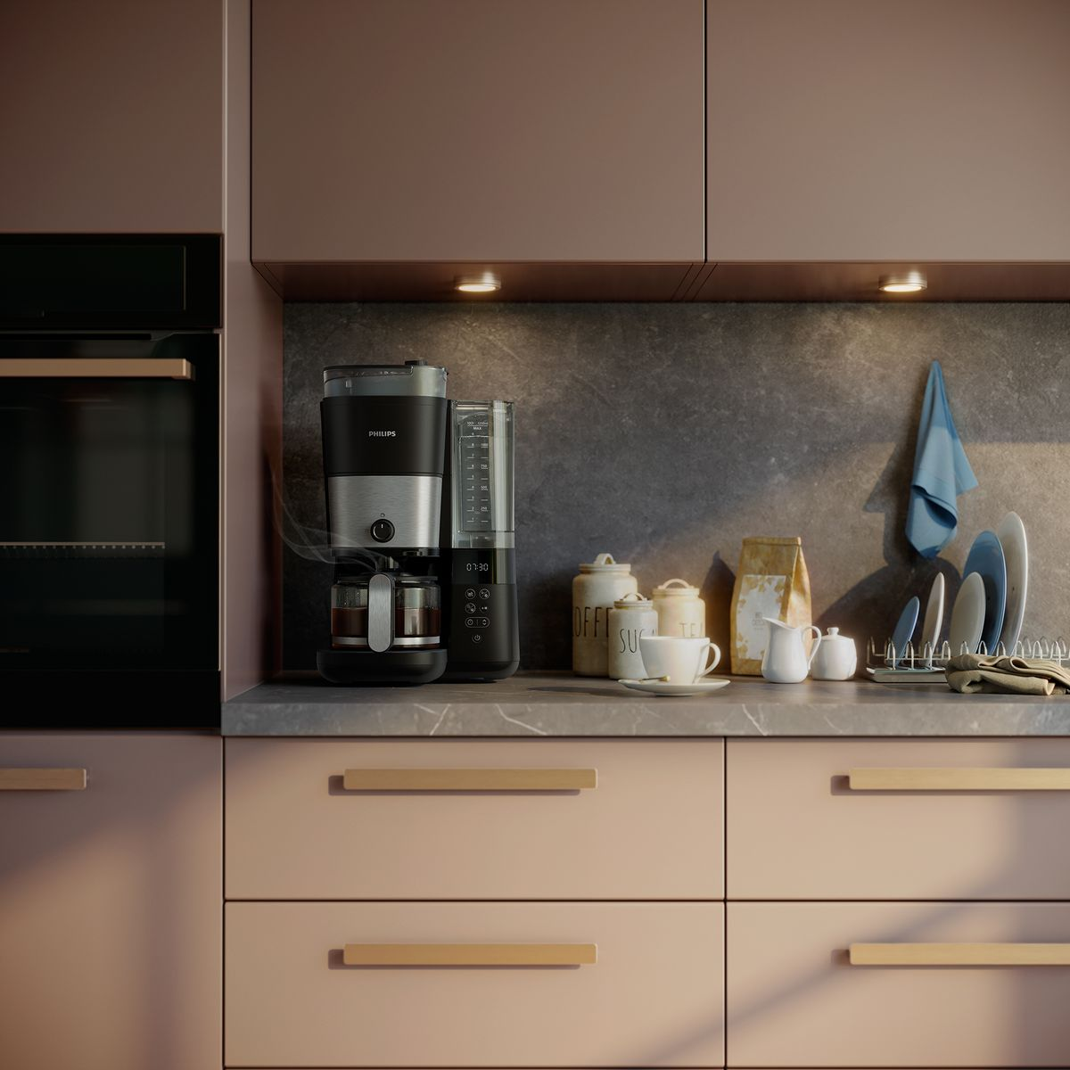 Scena kuchenna z ekspresem do kawy, filiżankami, talerzami i słoikami na blacie. Szafki są u góry i na dole.