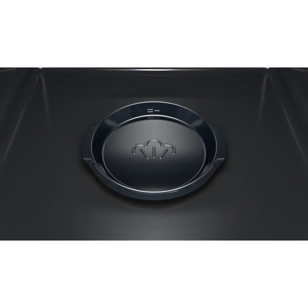 Zbliżenie ciemnoszarego urządzenia z okrągłym, wpuszczonym elementem. Posiada symbol pary i wskaźniki poziomu.