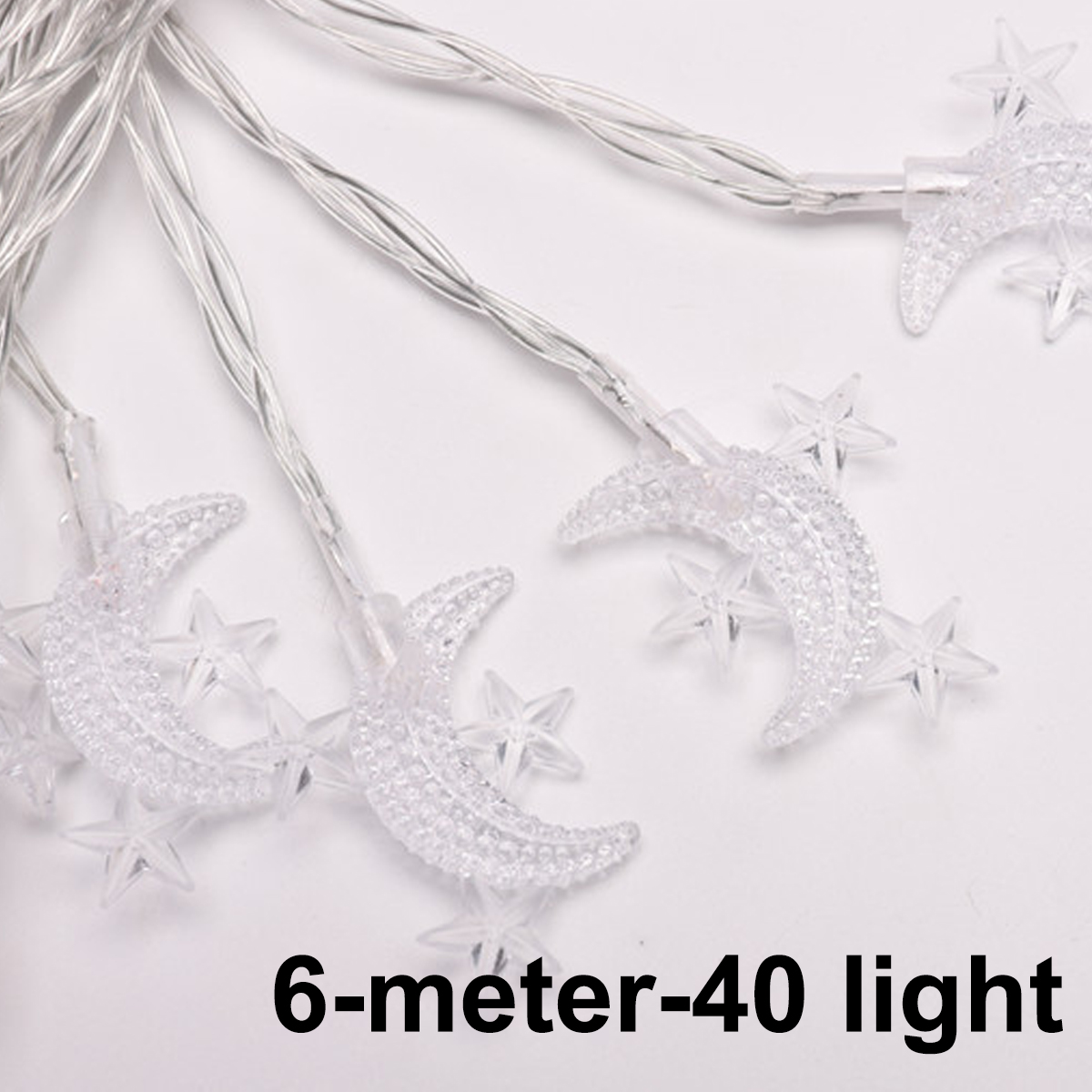 Lichterketten mit durchsichtigen Monden und Sternen auf weißem Hintergrund. Der Text '6-Meter-40 Licht' steht unten.